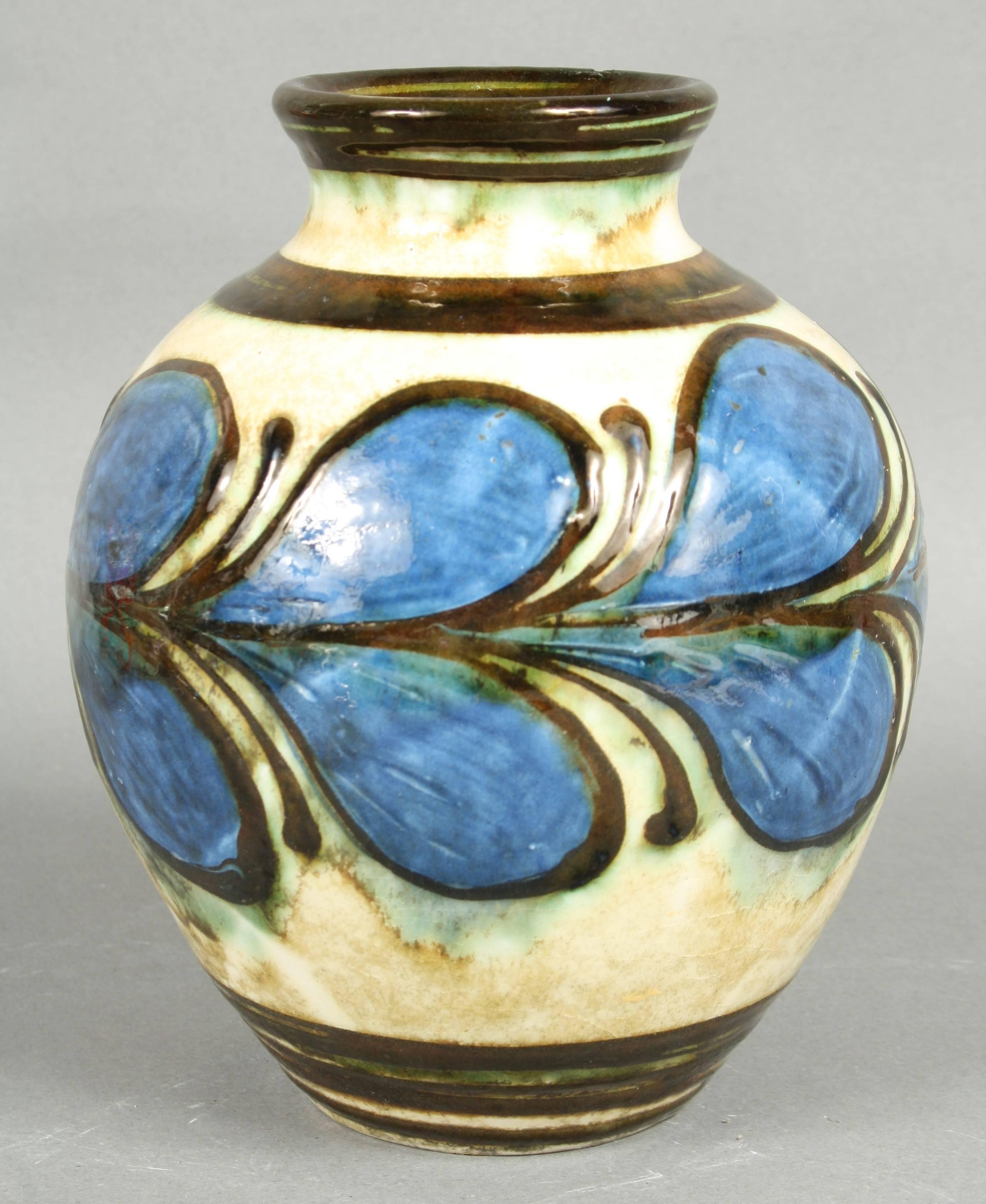 Kähler, HAK, glazed stoneware vase, 1930s. White glazed and blue leafs all the way around the vase. It has a small area where the glaze has crackles. Beautiful colours and shape.