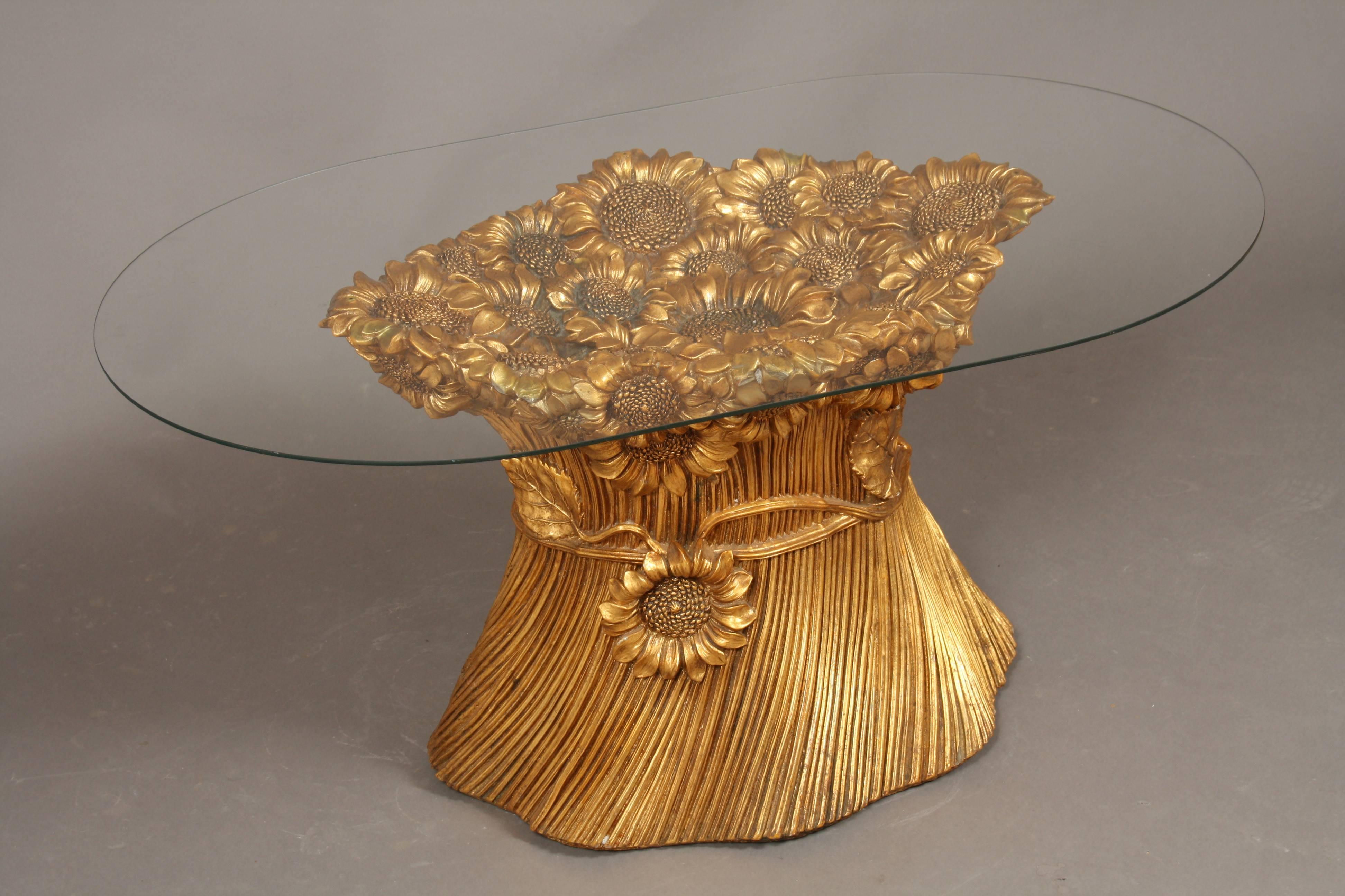 Regency golden sunflower coffee table, Italy, Morex, 1970. Gorgeous Hollywood Regency coffee table made in the 1970s. The table base is made of plaster-like, hard material. The base has sunflowers on top and sides. Also beautiful leaves on sides.