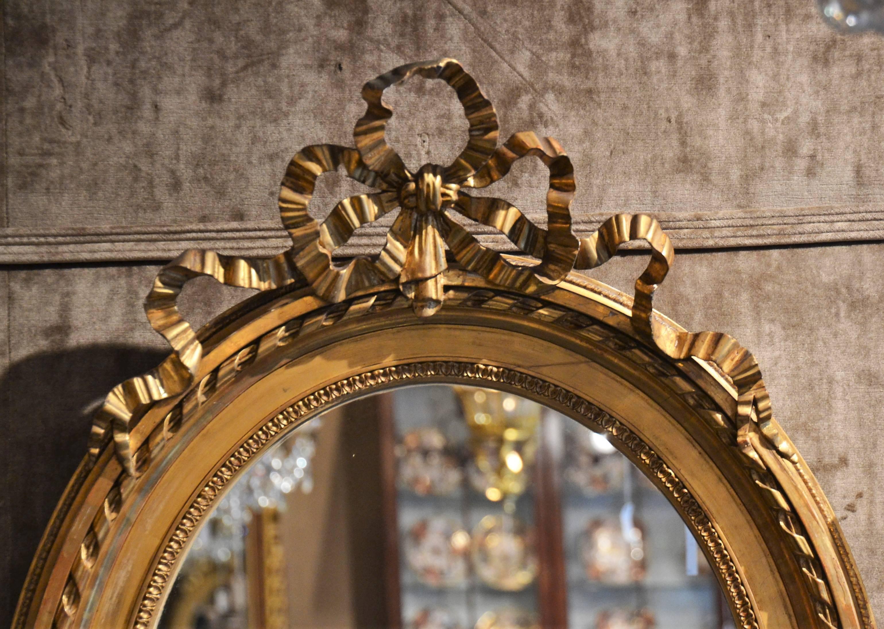 Pair of antique french Louis XVI oval mirrors, circa 1880.