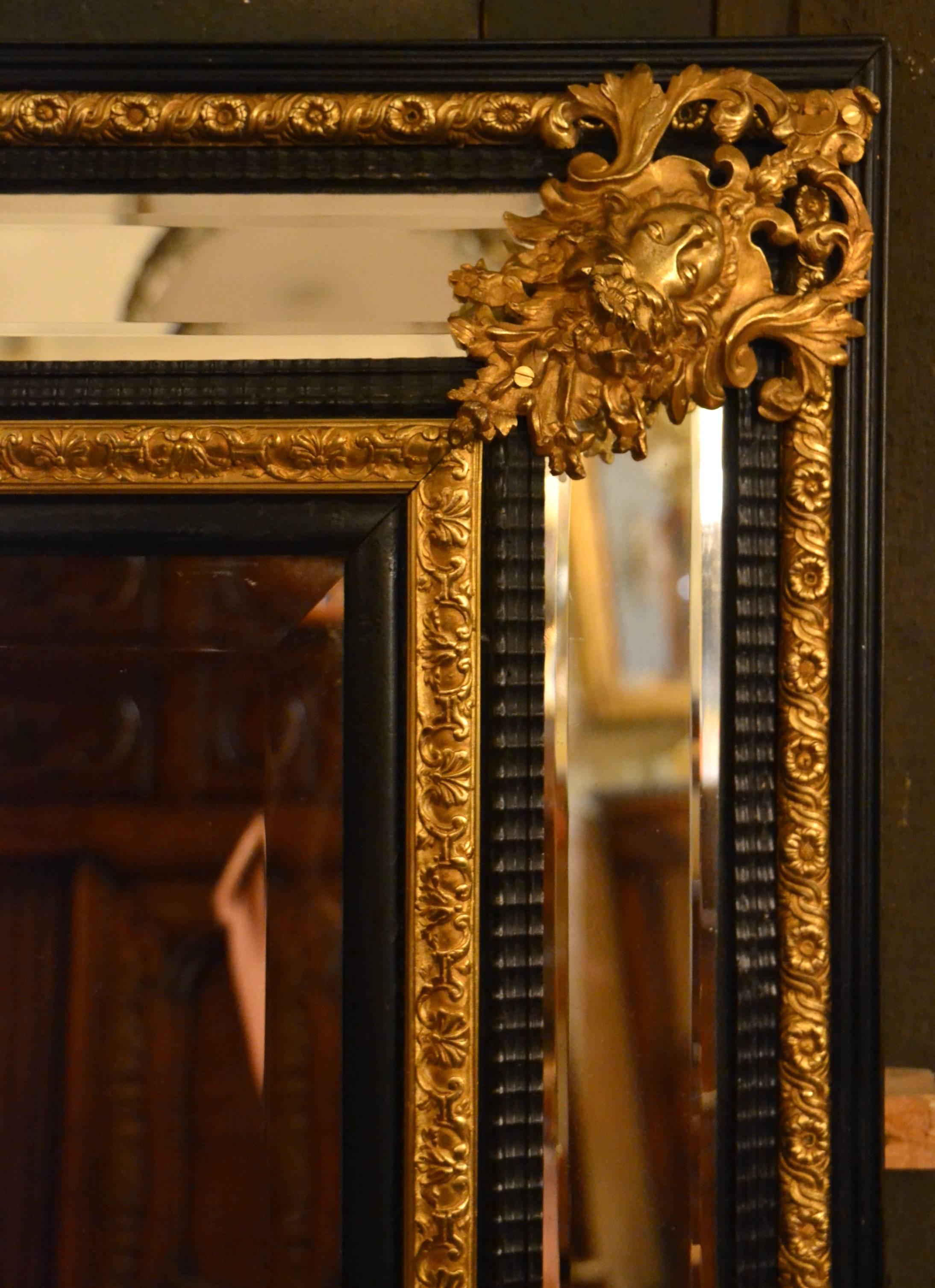 Antique 19th century French bronze doré and ebonized mirror, circa 1880.