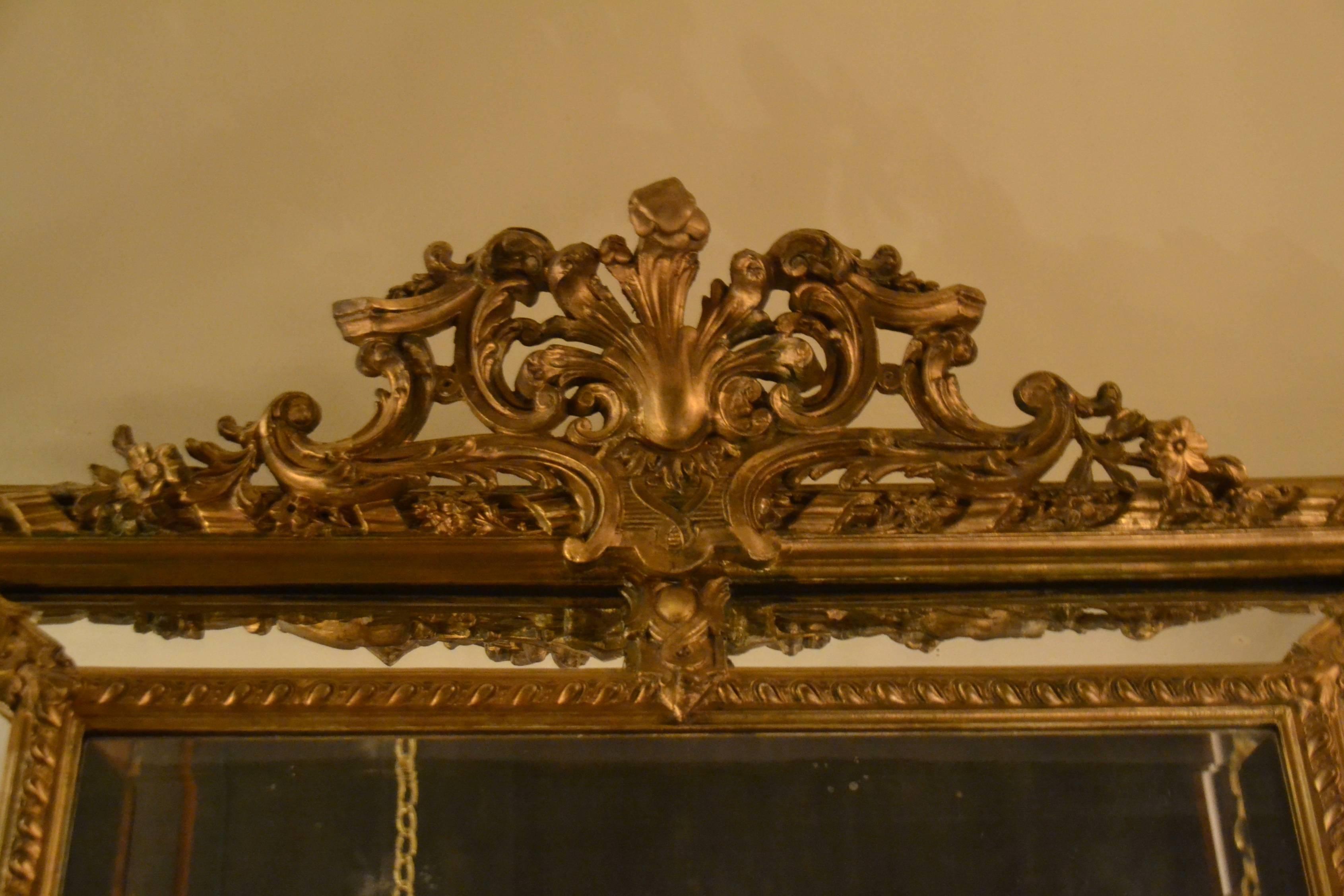 A handsome carved wood paneled mirror. If you like these mirrors, this one will not disappoint.