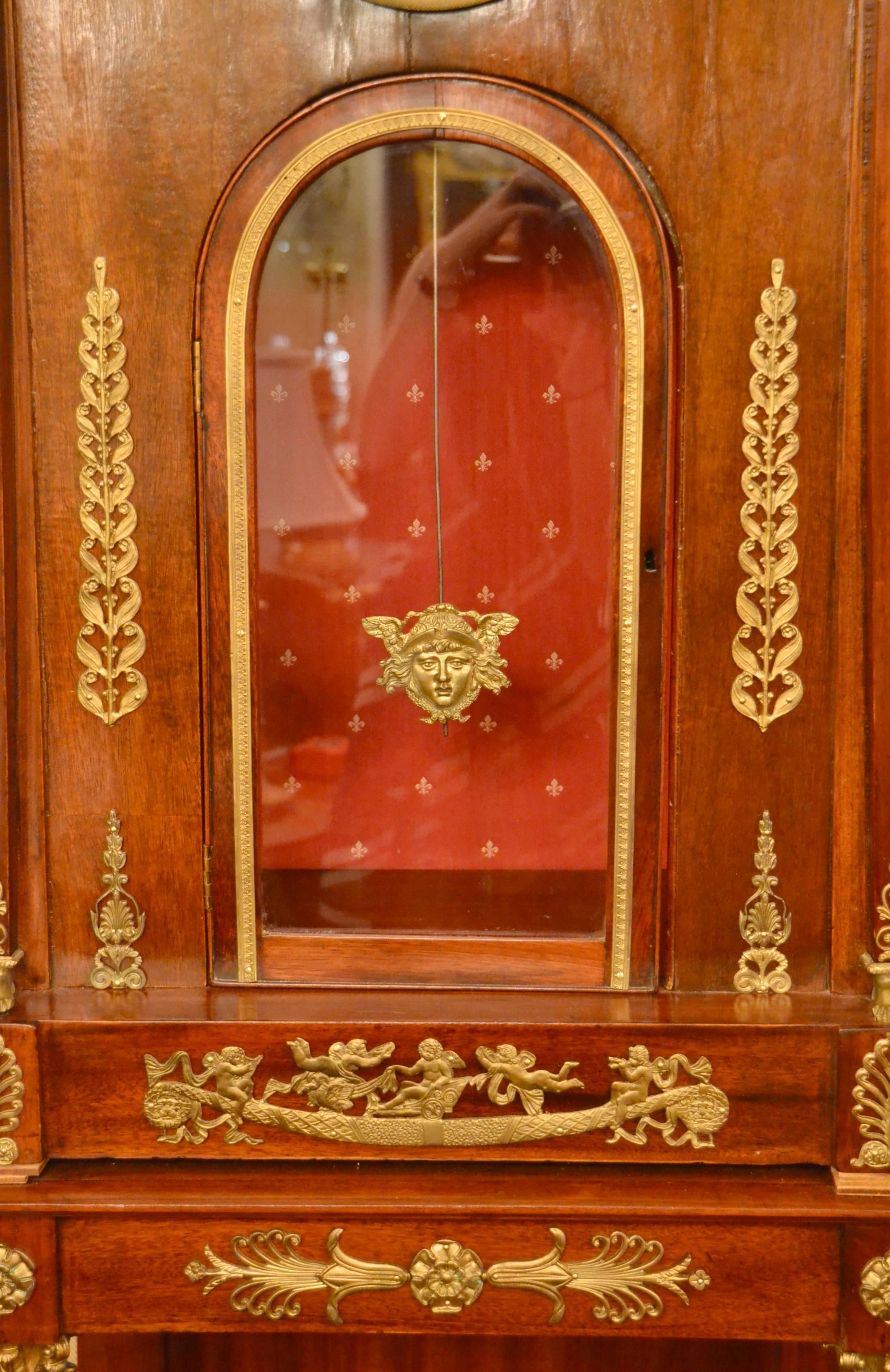 Antique 19th century Empire mahogany tall case clock.