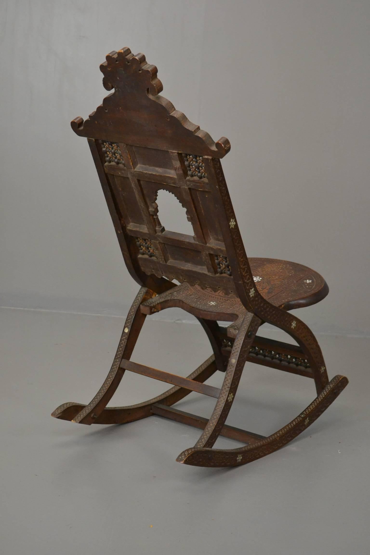 Early 20th Century Moorish Carved Teak and Inlaid Rocking Chair For Sale 4