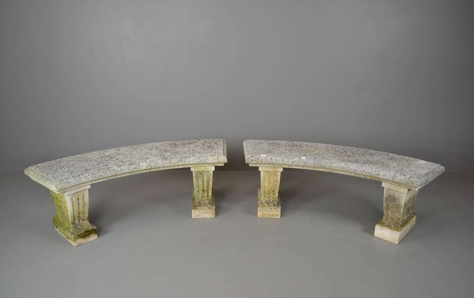 Pair of 20th century cast stone garden benches. Fluted supports with a gently curved top with moulded edge. Beautiful pieces to complement any garden.

Please click our logo for more items, and to see our full inventory.