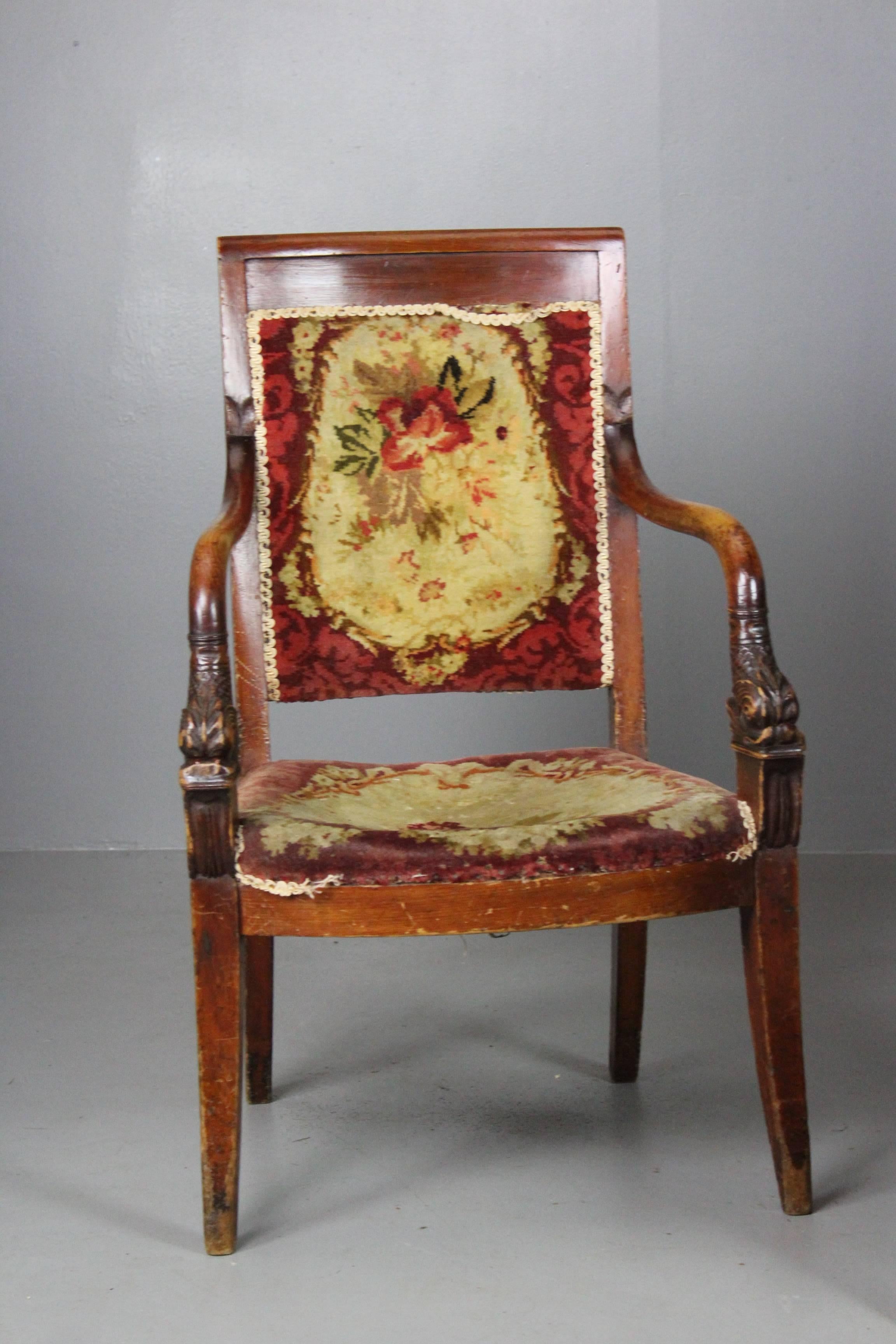 Pair of French chairs. Stunning pair of early 19th century Charles X open-armchairs. Stained pine and beech frame with dolphin arm supports, webbed seat and floral carpet upholstered seat and back on sabre legs.

Please click our logo for more