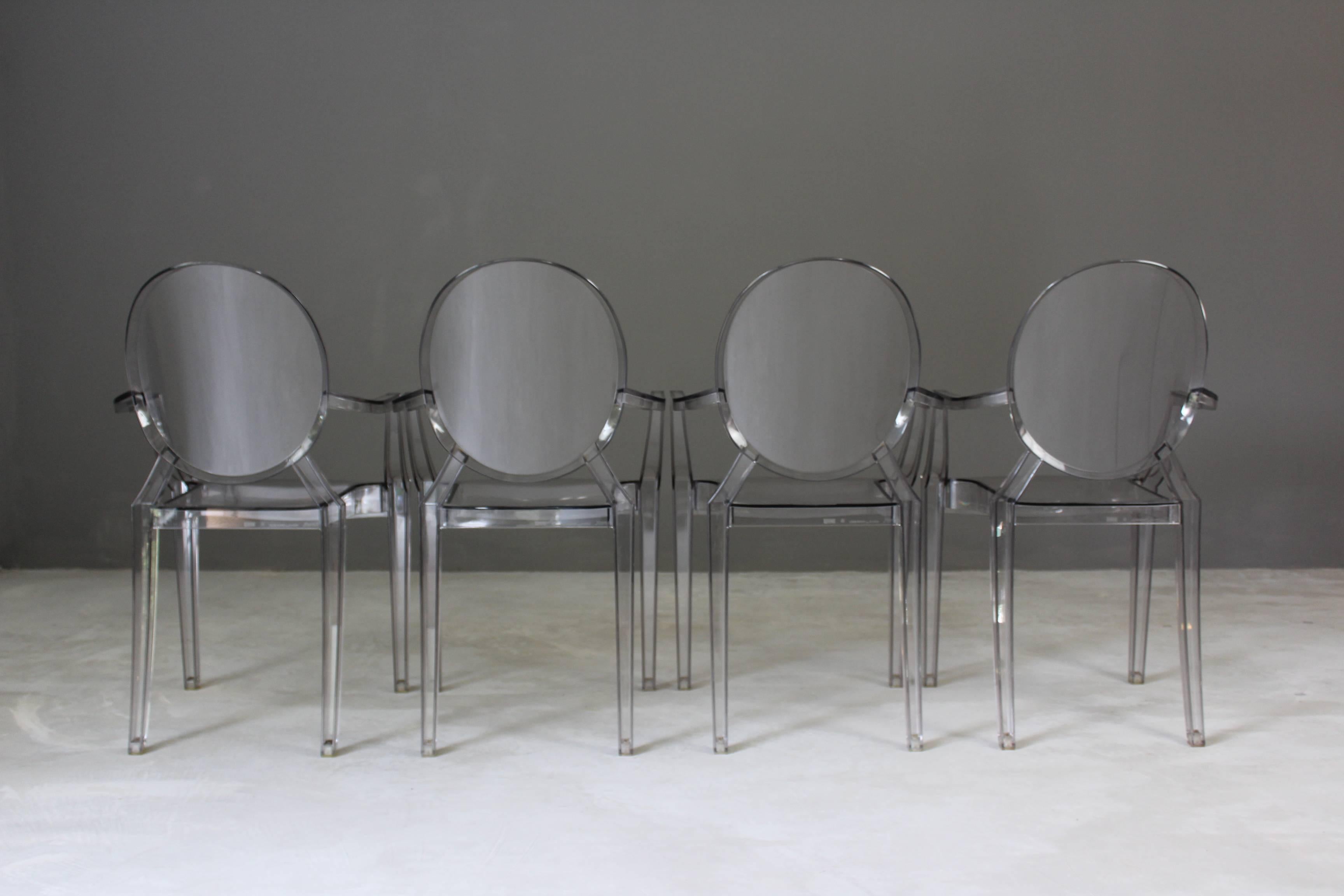 Four Kartell ghost chairs. Set of four smoke tinted arcylic Philippe Starck - Louis Ghost chairs made by Kartell with the stamp to the rear of the seat.

Dimensions: W 54 x H 94 x Depth 55 cm - H seat 47 cm.

Please click our logo for more