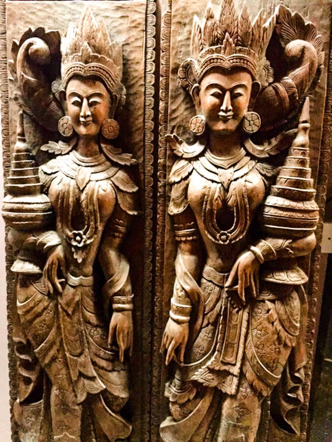 A Beautiful pair of South East Asian carved hardwood goddess panels. Nicely carved detail to face and bodies. Just over six feet tall and extremely heavy. Not sure of age. I would say 20th century. Highly decorative and well executed they would look