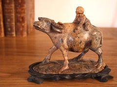 A Chinese Carved Soapstone Sculpture Of A Child On A Water Buffalo