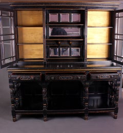An Aesthetic Movement Ebonised Parcel-Gilt Display or Apothecary Cabinet