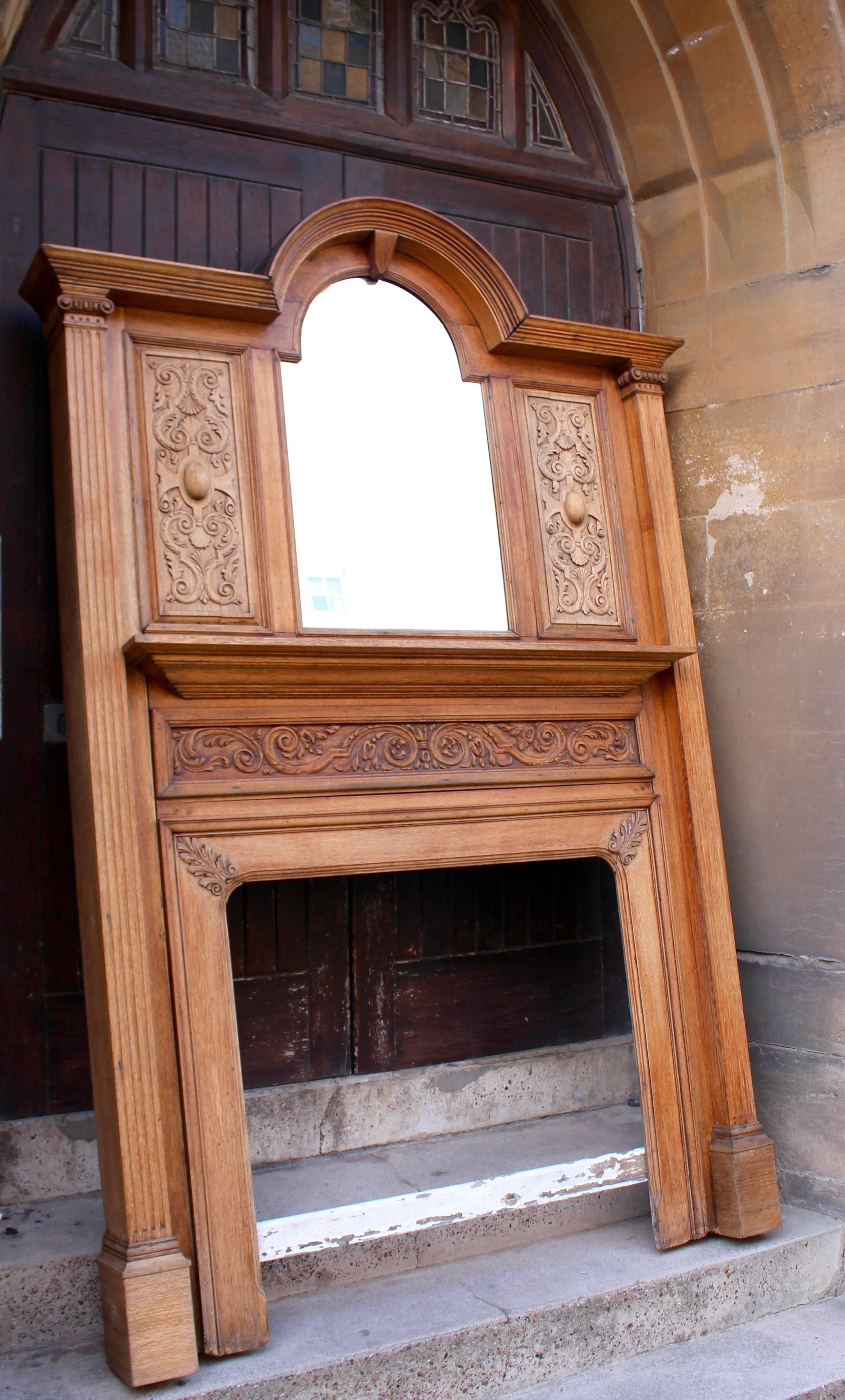 English Antique Carved Oak Fire Surround with Bevelled Mirror, circa 1900