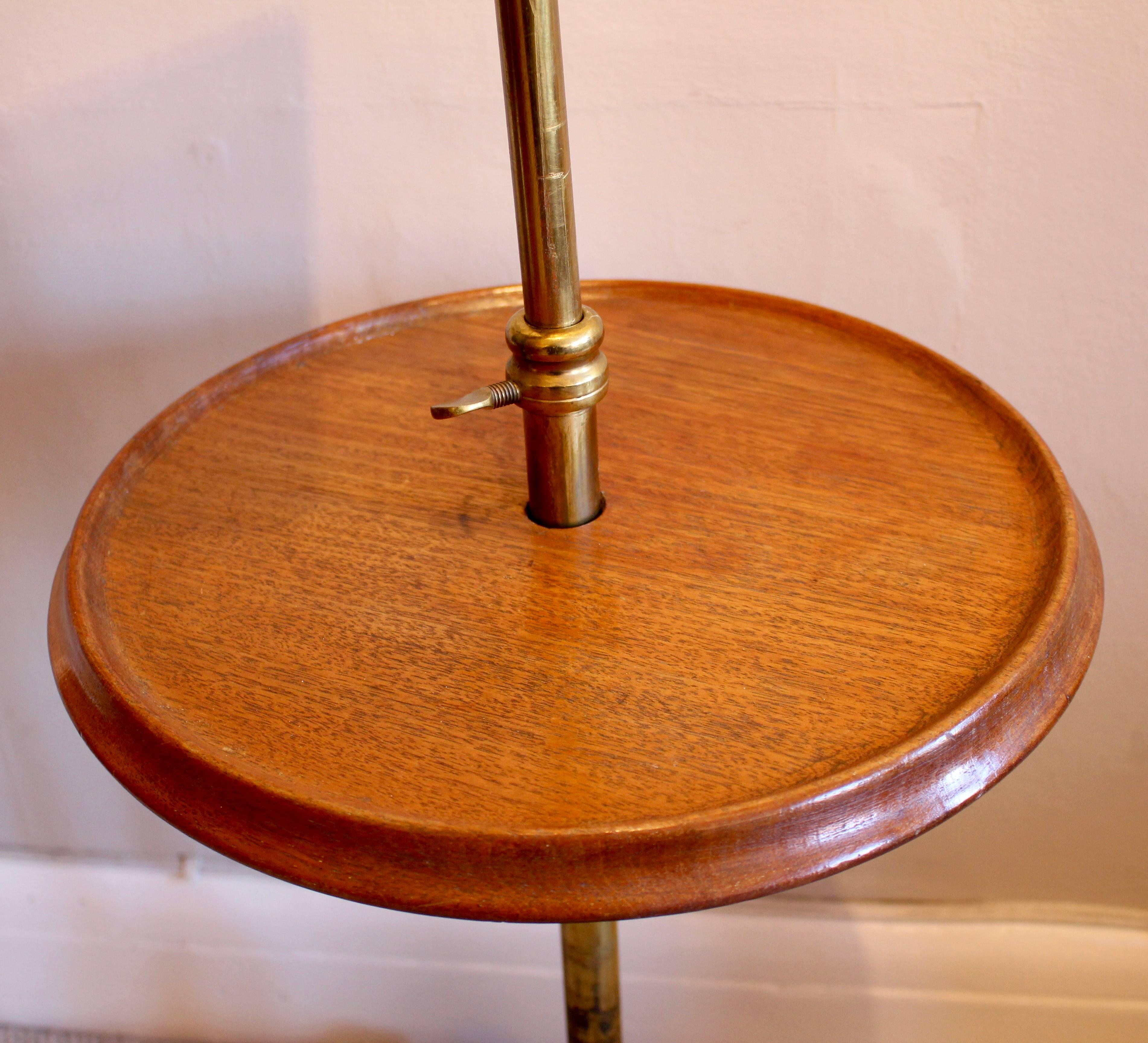 A lovely Victorian mahogany music stand. Having adjustable wooden lectern and circular tabletop. Standing on a cast iron four legged base and original ceramic castors. Brass stand with three adjustable thumb screws. A lovely and increasingly rare