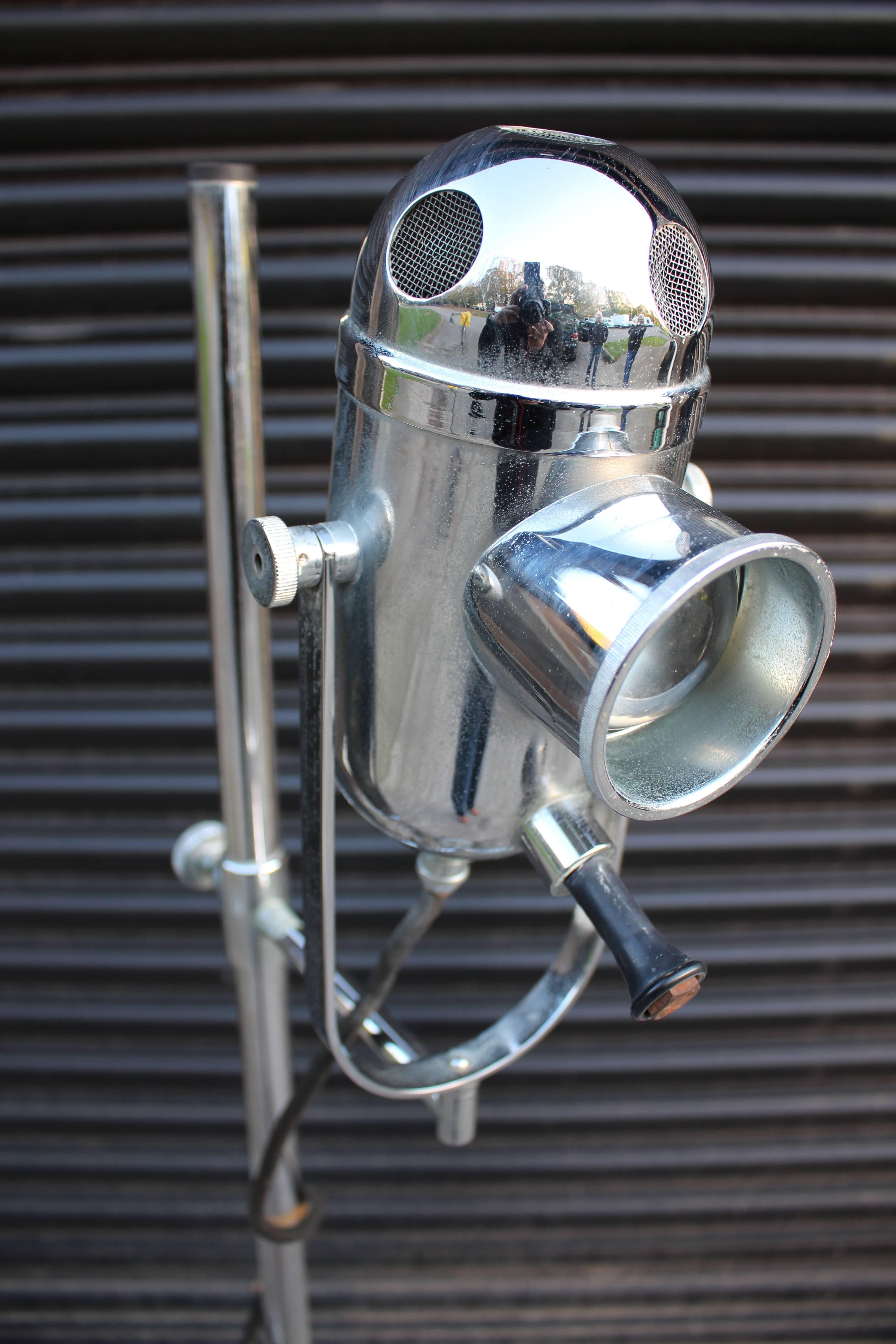 A vintage ENT medical floor standing bullseye lamp. Adjustable chromed light and heavy weighted base. Sourced from the Beneden Hospital Trust Museum in Kent, England.

Great looking Industrial style medical light. The chromed bulb housing having