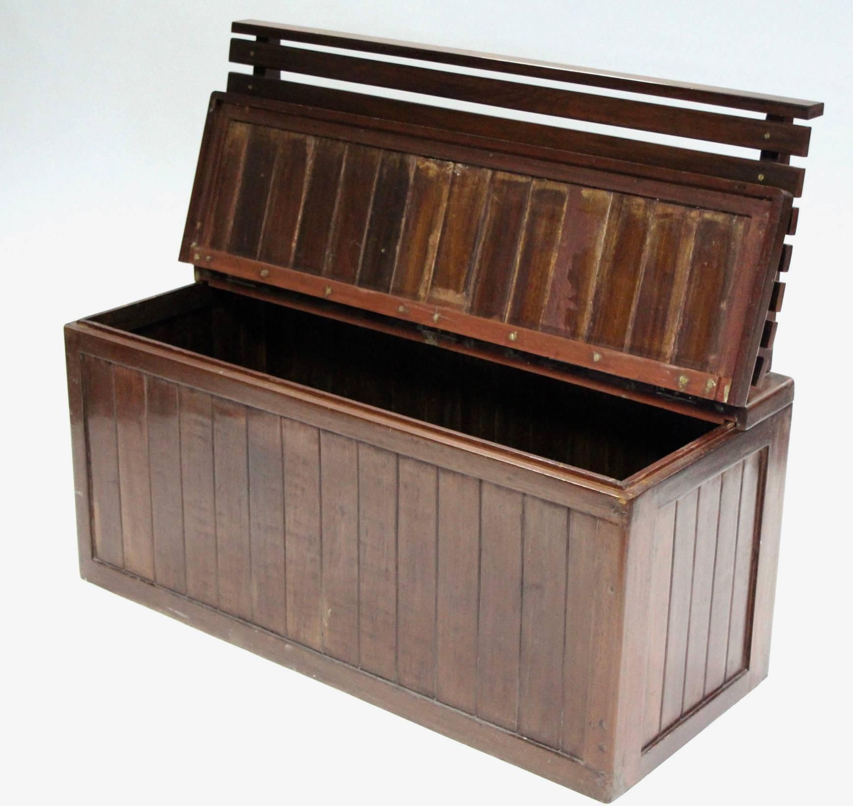 A slatted hardwood ship's deck seat with life jacket storage Circa 1950. Reclaimed from a Union-Castle Line passengers liner. The Union-Castle Line was a British shipping line that operated a fleet of passenger liners and cargo ships between Europe