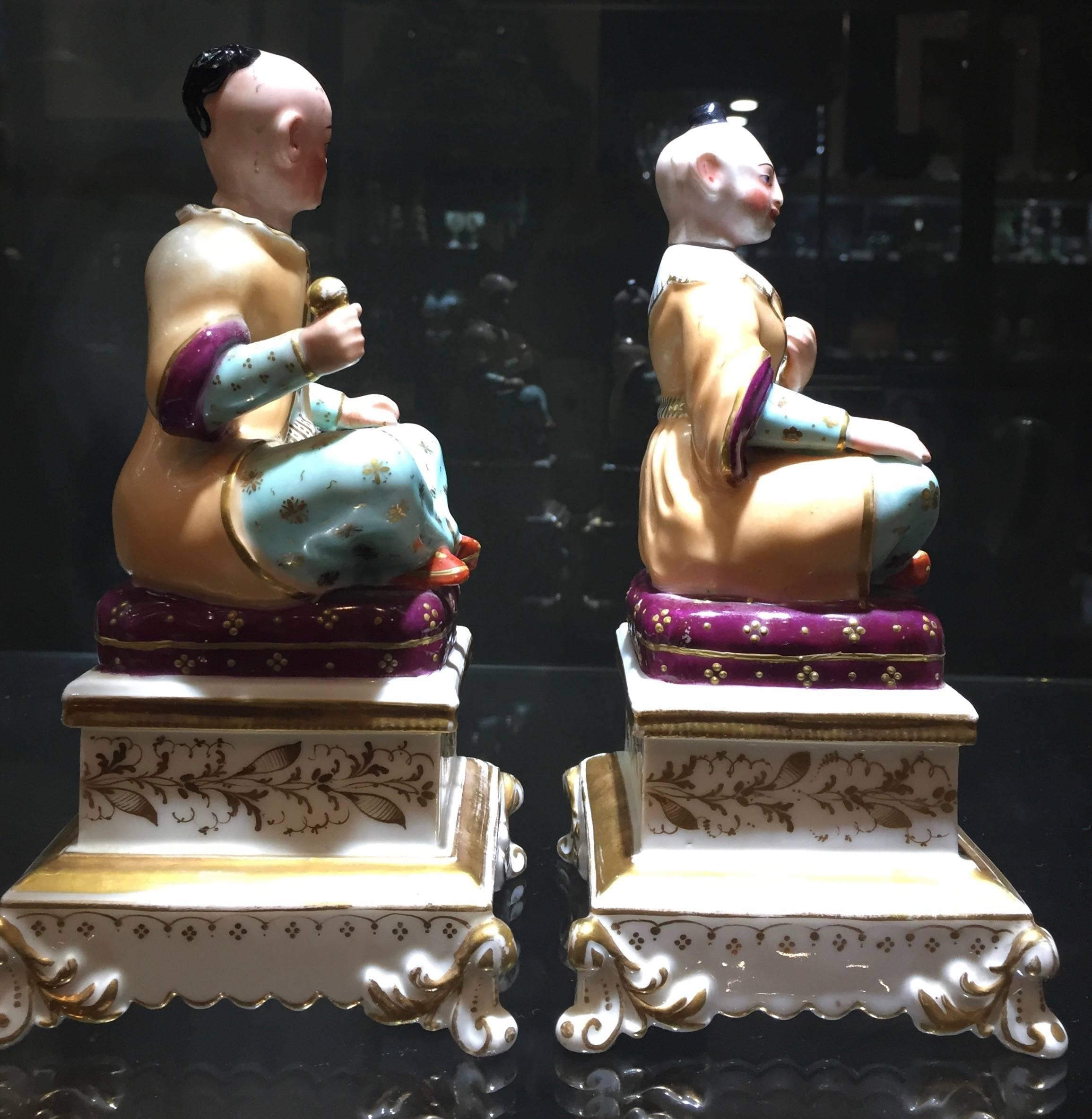 Chinoiserie pair of French 19th century porcelain perfume bottles, the heads are the stoppers, signed under the glaze.
Paris, circa 1900.