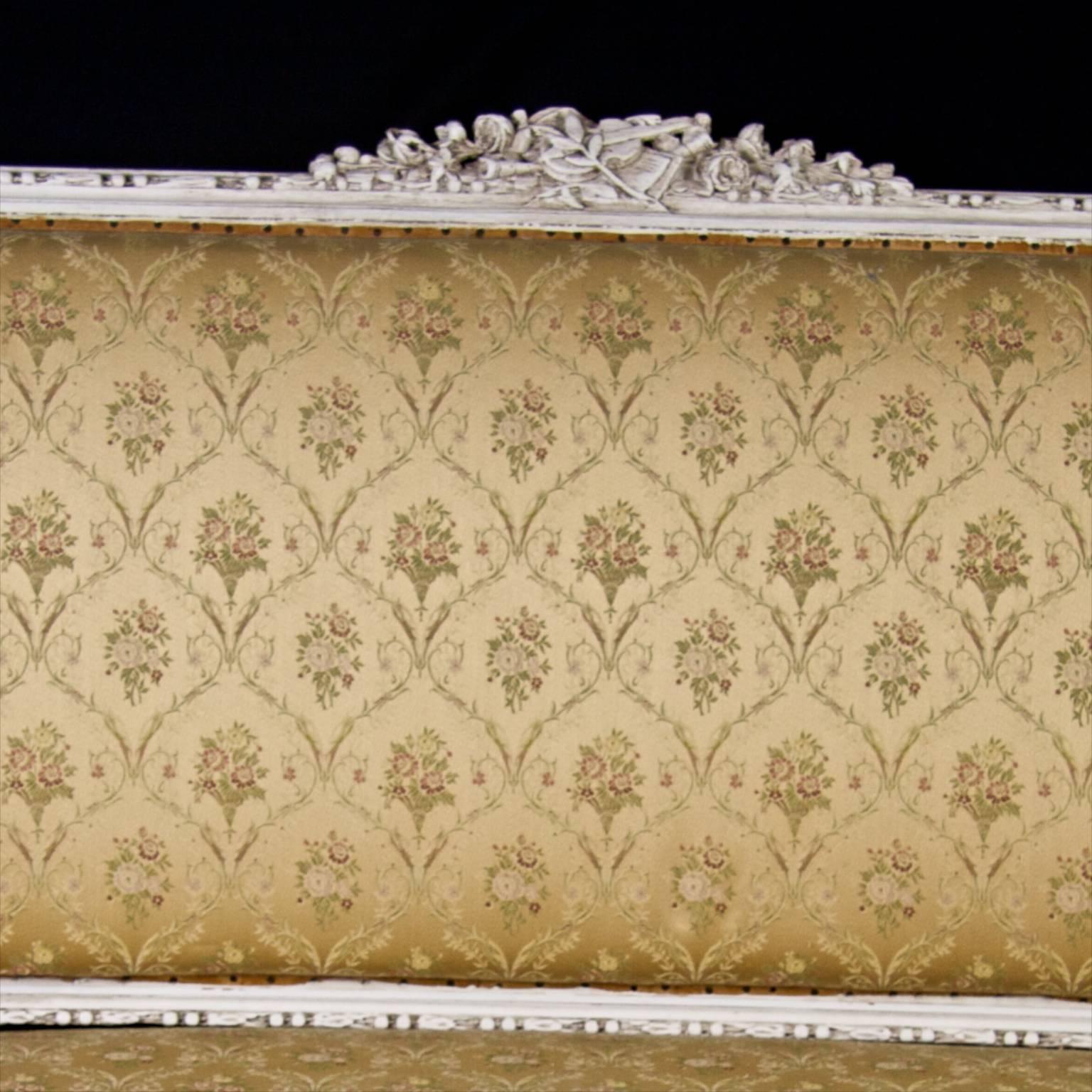 Late 19th century antique Swedish Gustavian sofa in later white paint with intricate carved canework , scroll detailing, rosettes, fluted legs and central carved relief.

Immense detail is really pleasing on the eye and unusually it has the two
