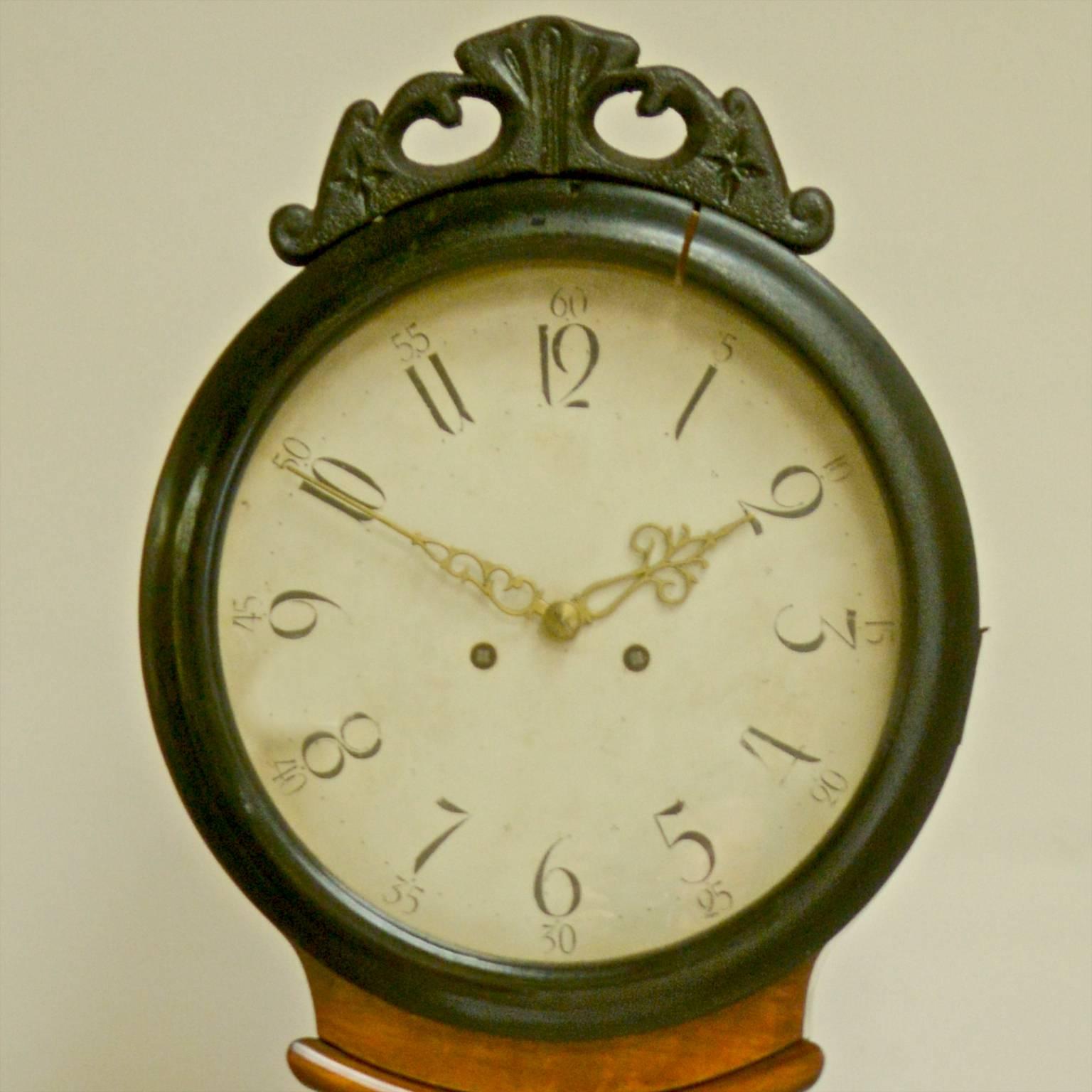 Rare example of a decorative 1800s antique Swedish mora clock in the Biedermeier style with ornate sunrise motif at the waist and ormolu style hood with stunning hand-carved detailing to the body. You very rarely find these clocks in this style or