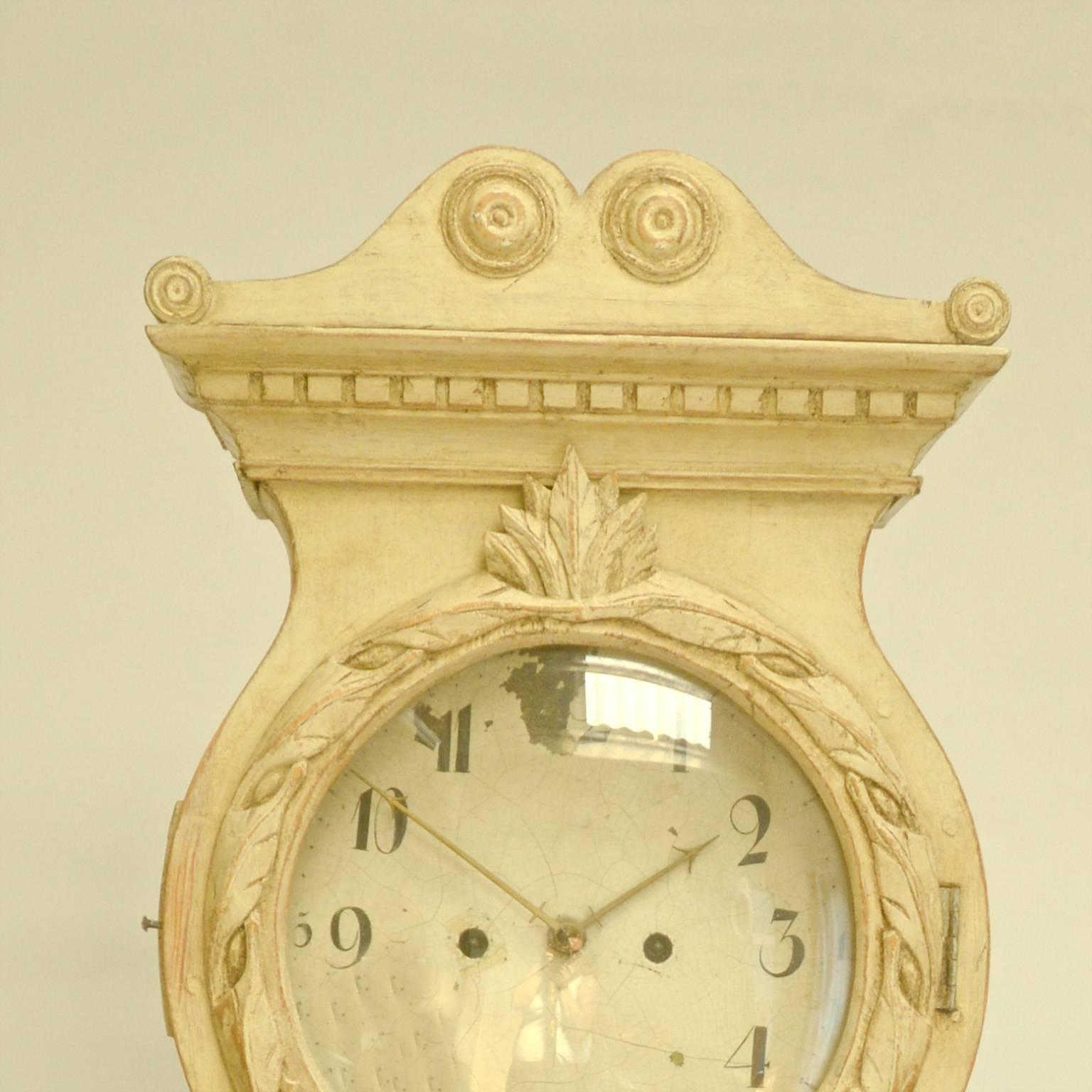 Wonderful 1800s Swedish antique Mora clock with sumptuous carved detail in the classic Gustavian style.

Clocks like these are very rare and hard to find - intricate carved swags, wreaths, highly decorated crown, pyramid base.

This original 1800s
