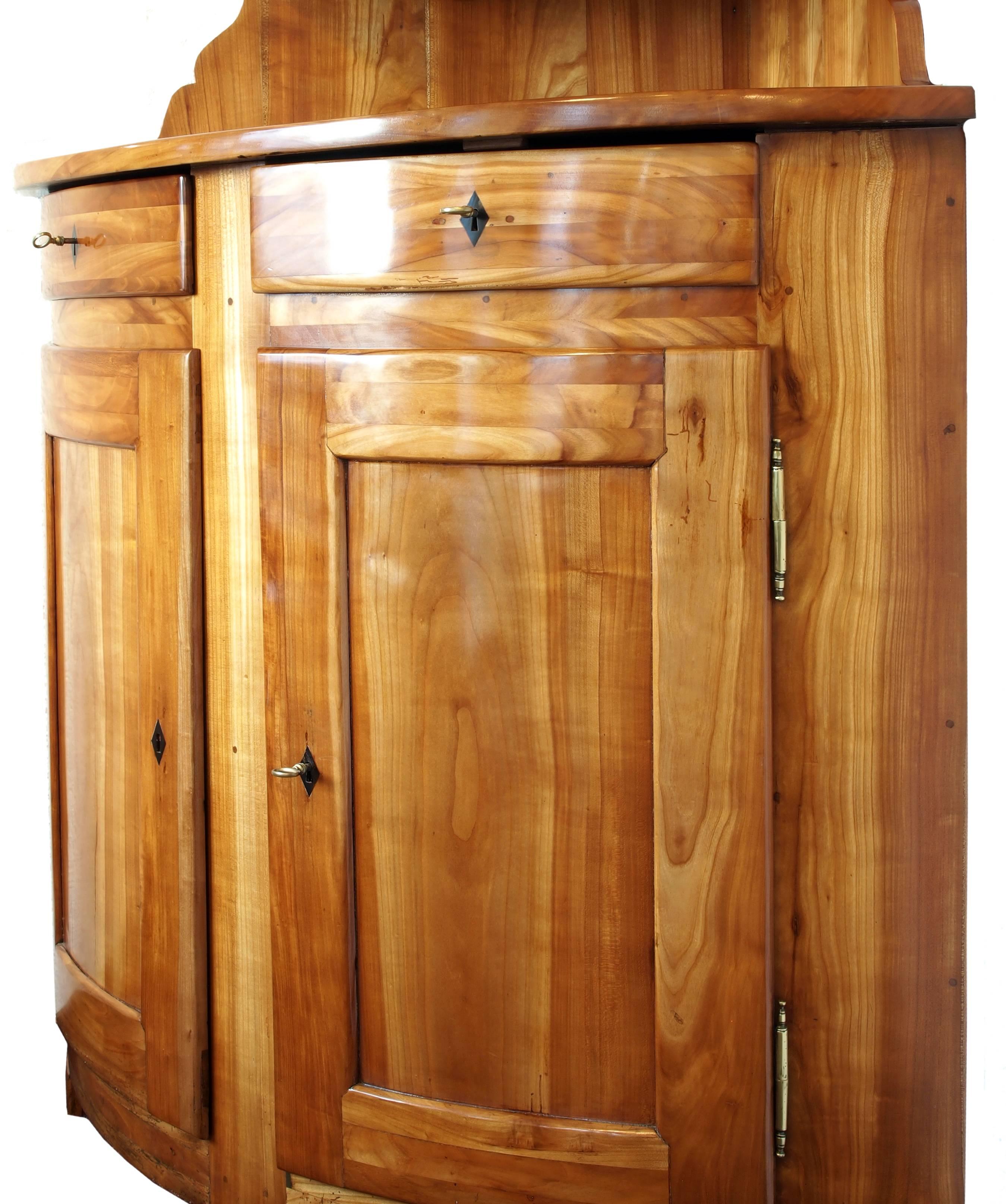 Polished Early 19th Century Solid Cherry Biedermeier Corner Cabinet For Sale