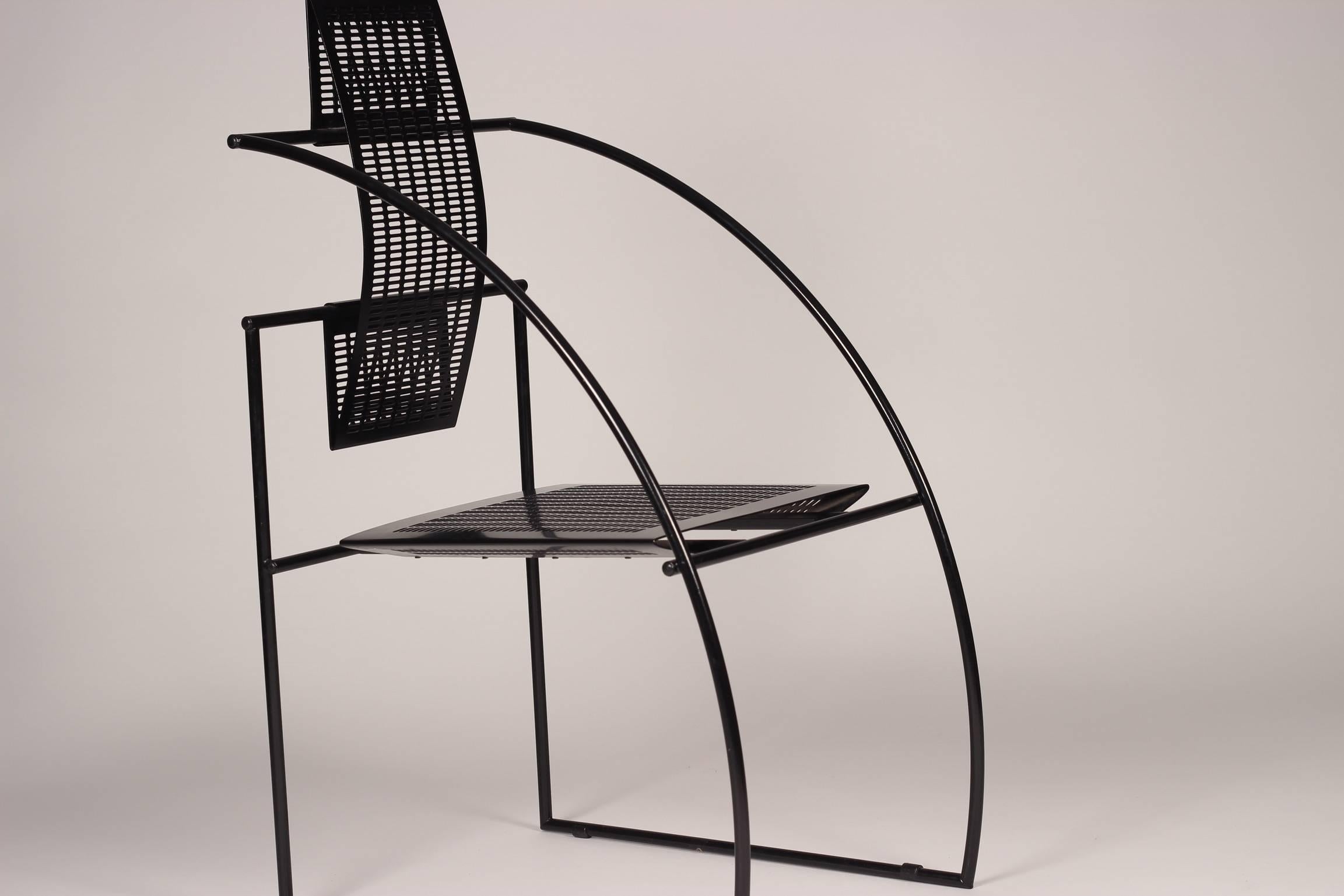 The Quinta chair by Italian architect and designer Mario Botta is constructed of a steel rod frame and perforated steel to form the seat and back.