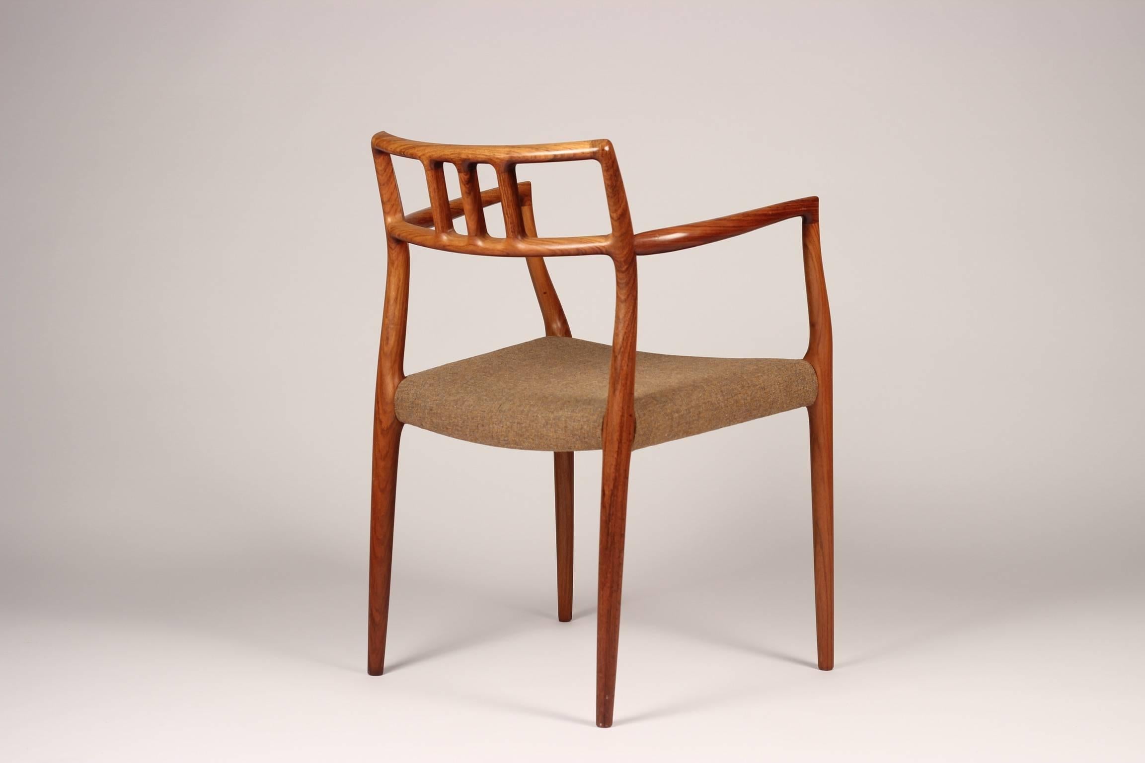 A beautiful, timeless and rare pair of model no.64 rosewood dining chairs designed by Niels O. Møller and made by J.L Møller Møbelfabrik. The chairs were discovered as a pair and are in wonderful original condition, with the potential to recover in