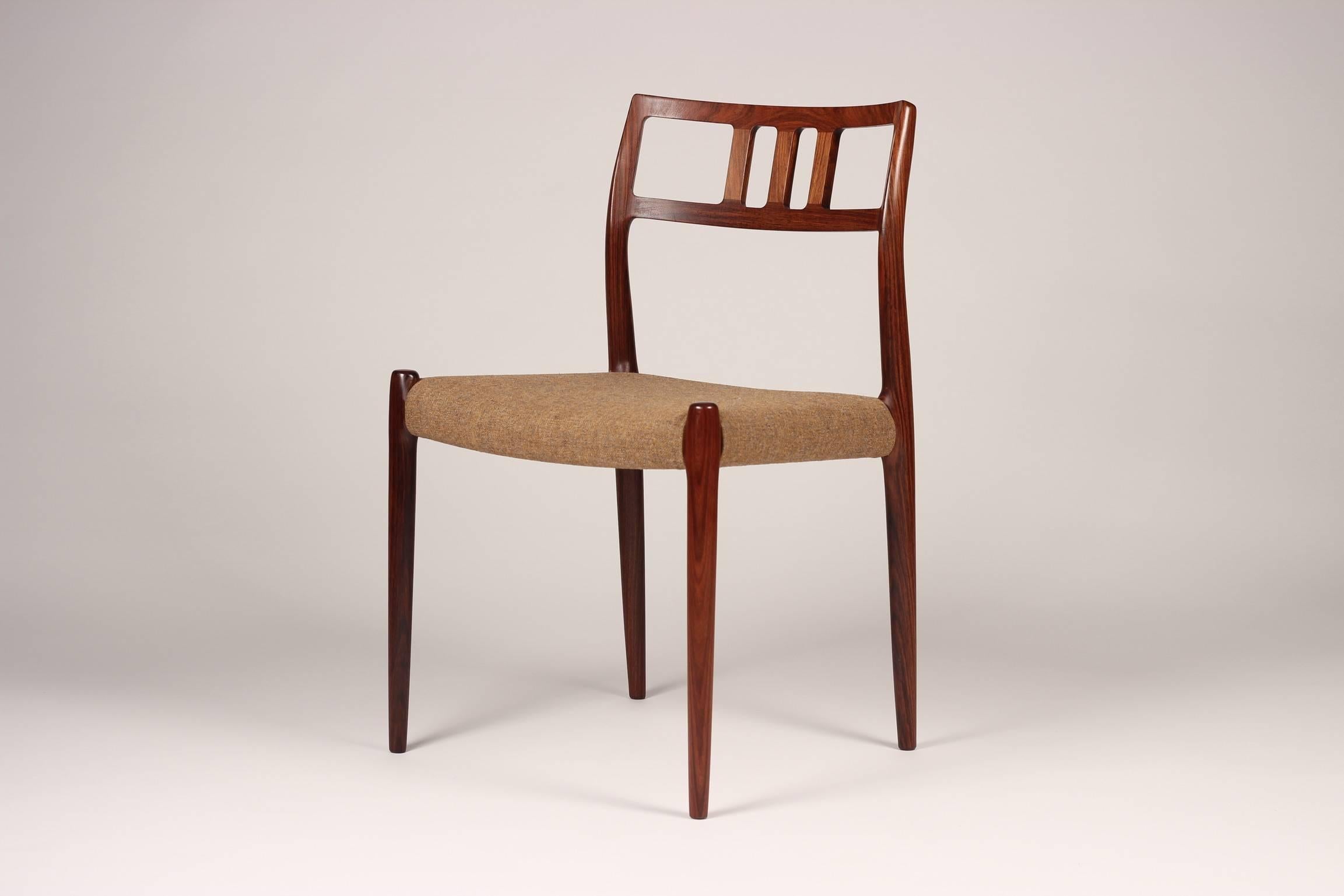 A beautiful, timeless and rare set of rosewood dining chairs designed by Niels O. Møller and made by J.L Møller Møbelfabrik. The chairs were discovered as a complete set and are in wonderful original condition, with the potential to recover in ones