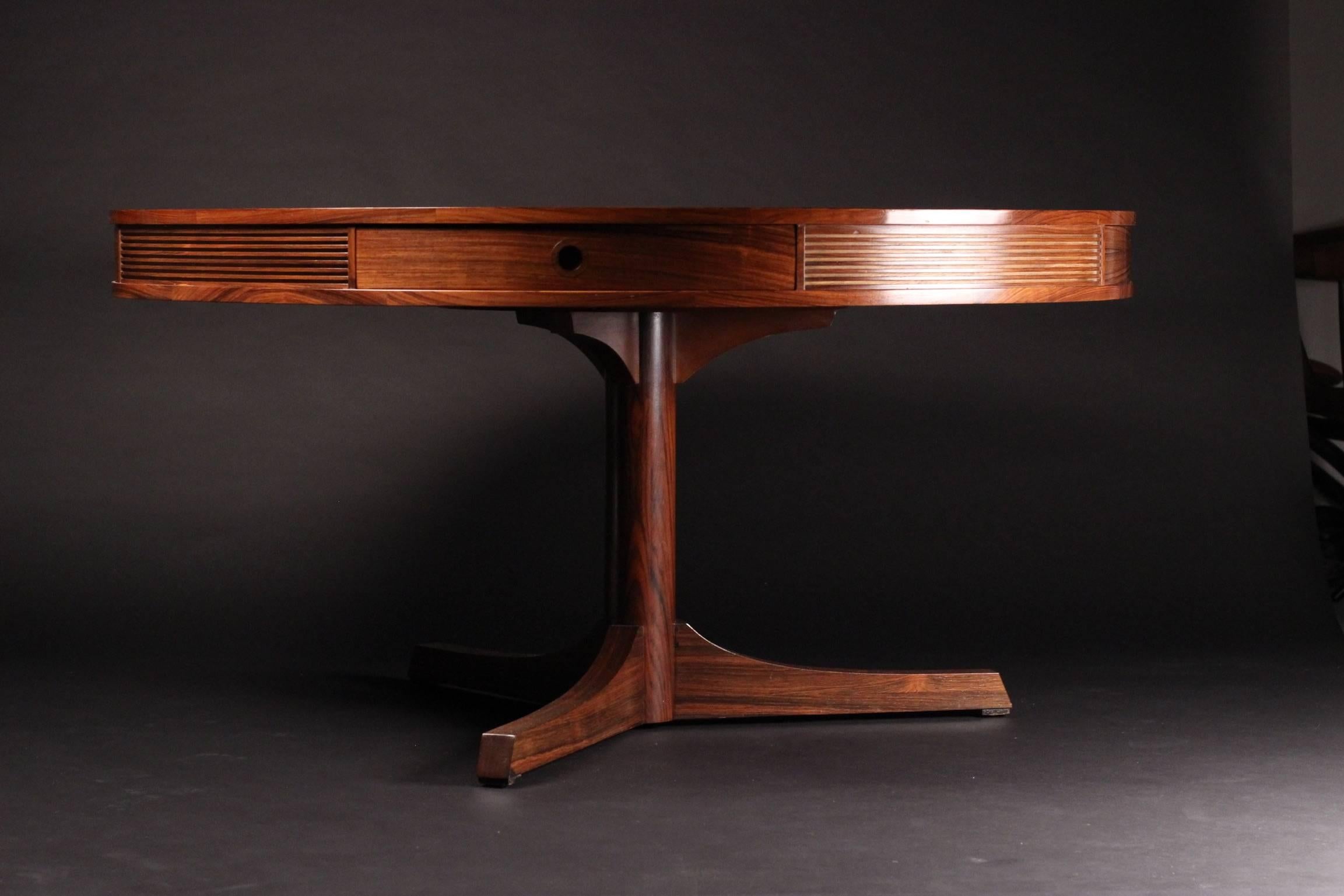 Designed by the highly respected Robert Heritage and made by the wonderful sounding Archie Shine Ltd. This piece was retailed at the World famous furniture store Heals of London, circa 1965.
A large beautiful and highly distinctive grained Rosewood