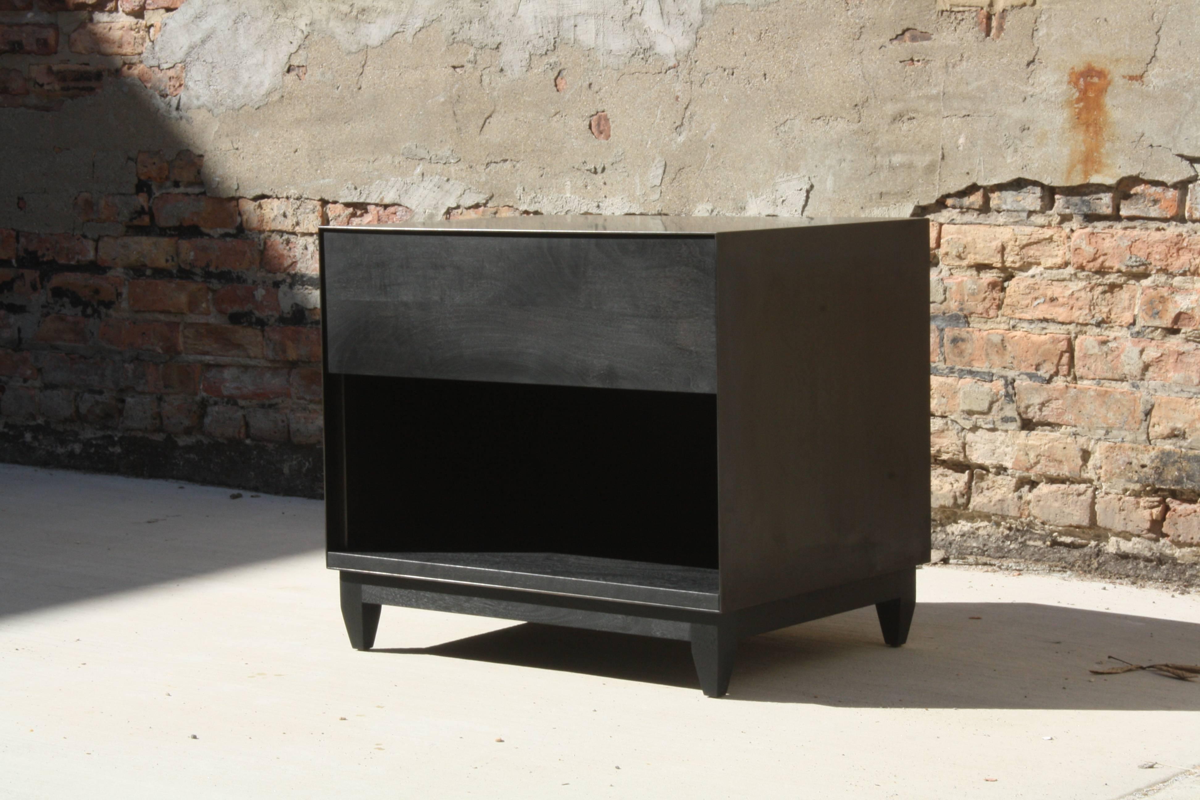 Handmade in Chicago by Laylo Studio, this customizable nightstand or end table features a blackened steel case with soft close drawer runners and a solid wood interior, drawer front and base. The patinated metal case allows for a minimal front edge