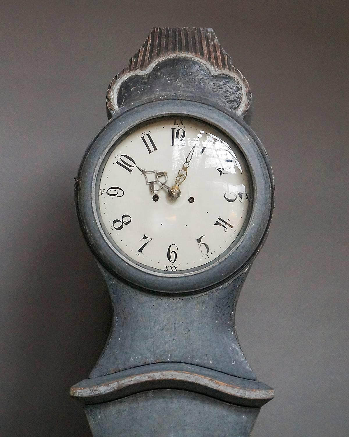 Swedish tall case clock in original paint by the artist and carver Sven Nilsson Morin, circa 1810. Morin was a crofter’s son (1747–1813) who carved altarpieces and painted churches throughout Småland in addition to clock cases.

The original clock