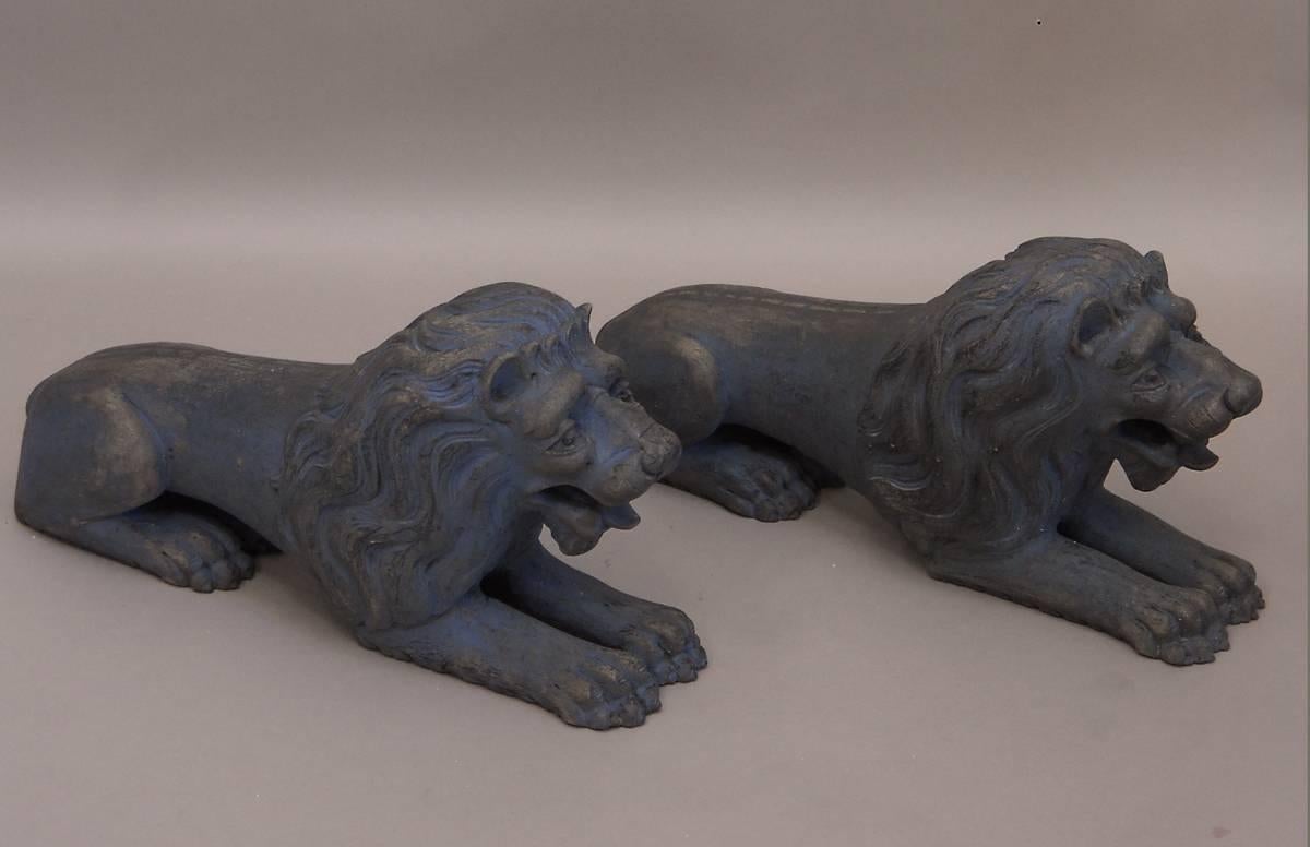 Pair of lions couchant, Sweden, circa 1820, carved of wood and retaining traces of their original blue paint. Wonderfully expressive faces.