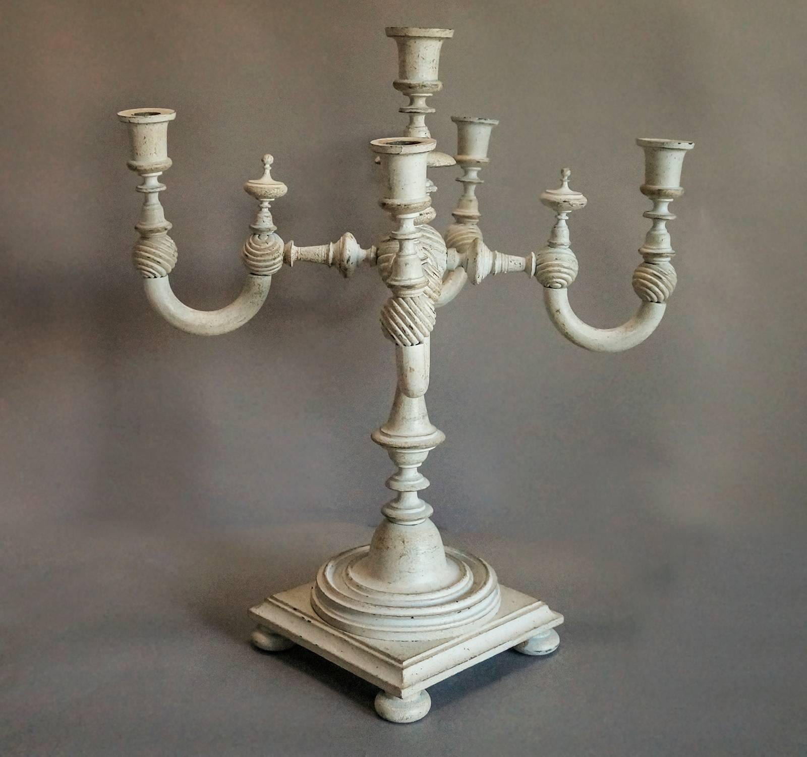 Turned and carved wooden candelabrum, Sweden, circa 1840. Wonderful piece of Folk Art with adjustable arms.