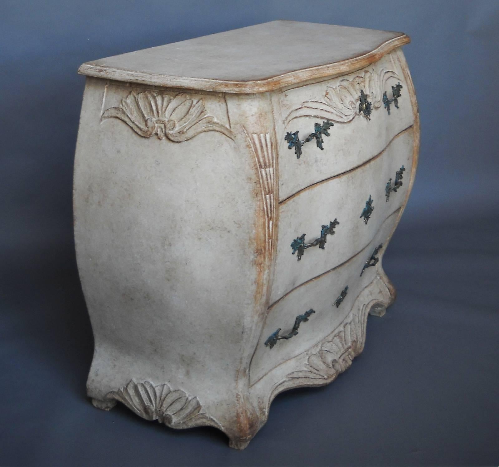 Chest of three drawers, Sweden, circa 1860, with bombé form and carved detail. A beautiful piece.
