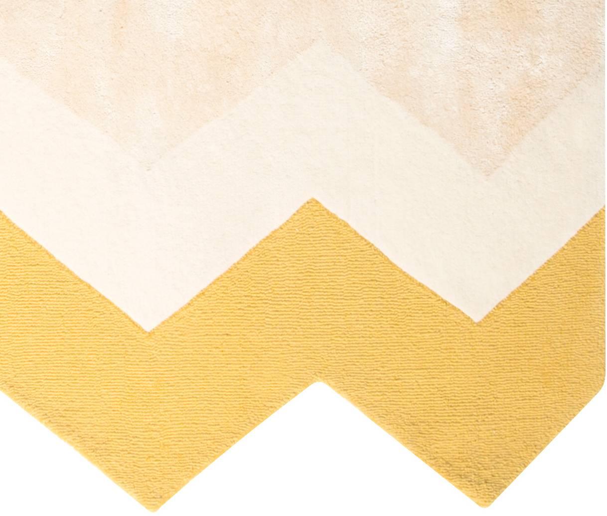 The Zuko rug features a fun chevron edge and matching print, in a soft, neutral color palette. Not another neutral to help ground a room. Rugs that make the room. Hand tufted rug made of a wool/viscose blend. Designed by Pieces.

Custom sizes are