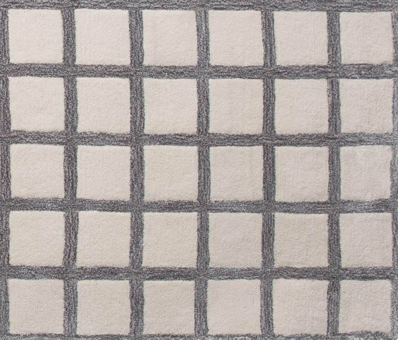 Maschi rug in pieces signature grid print. Under foot but in your face, rugs that make a statement. Hand tufted rug made of a wool/viscose blend. Designed by Pieces.

Custom sizes are available. Made by hand in India.