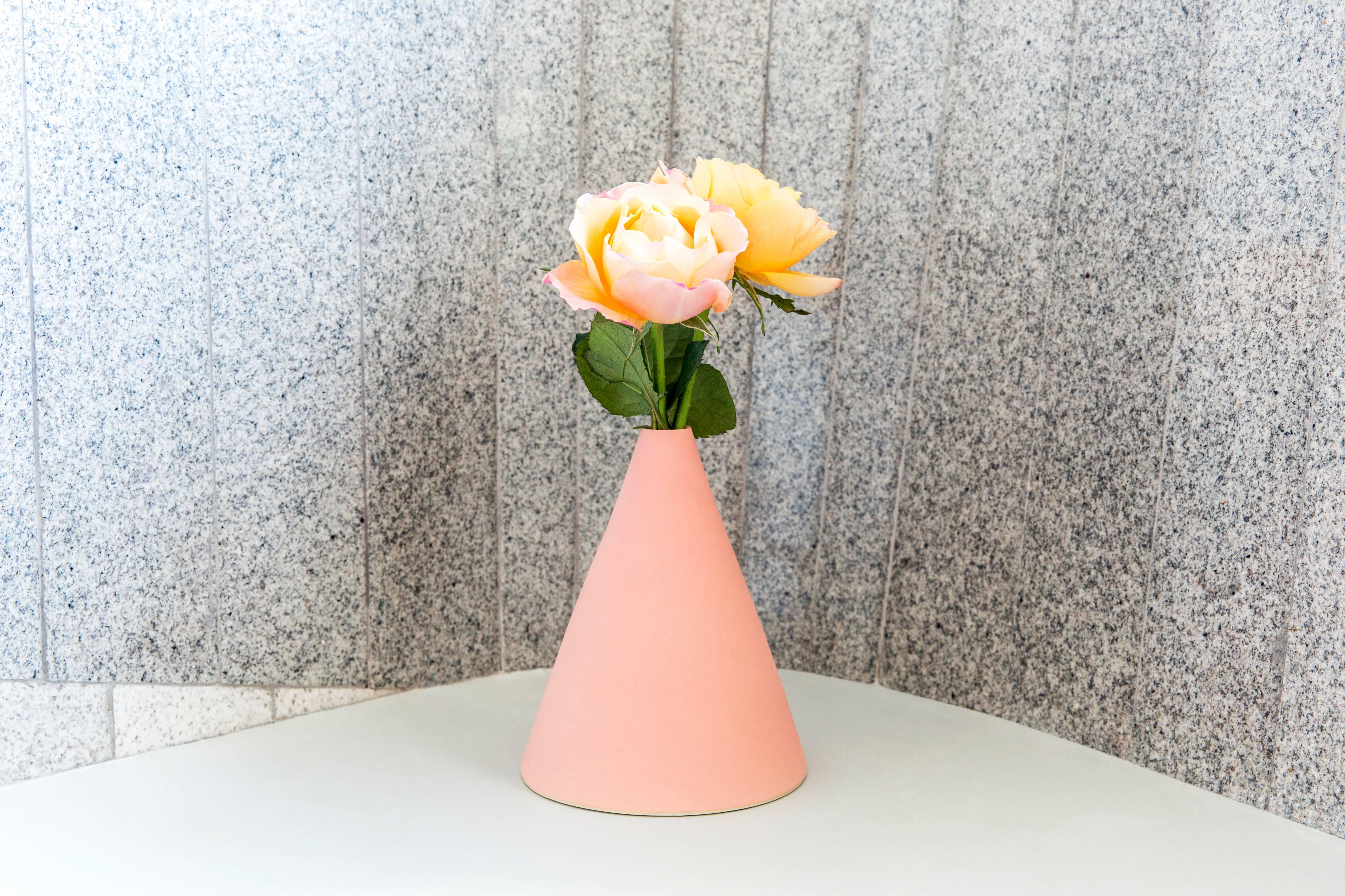The Flora ceramics are cleverly designed to make arranging your flowers easy. So simple you can't mess this up. Pretty. Modern. Call it pretty modern. Each piece is handmade. Shown in Melon.