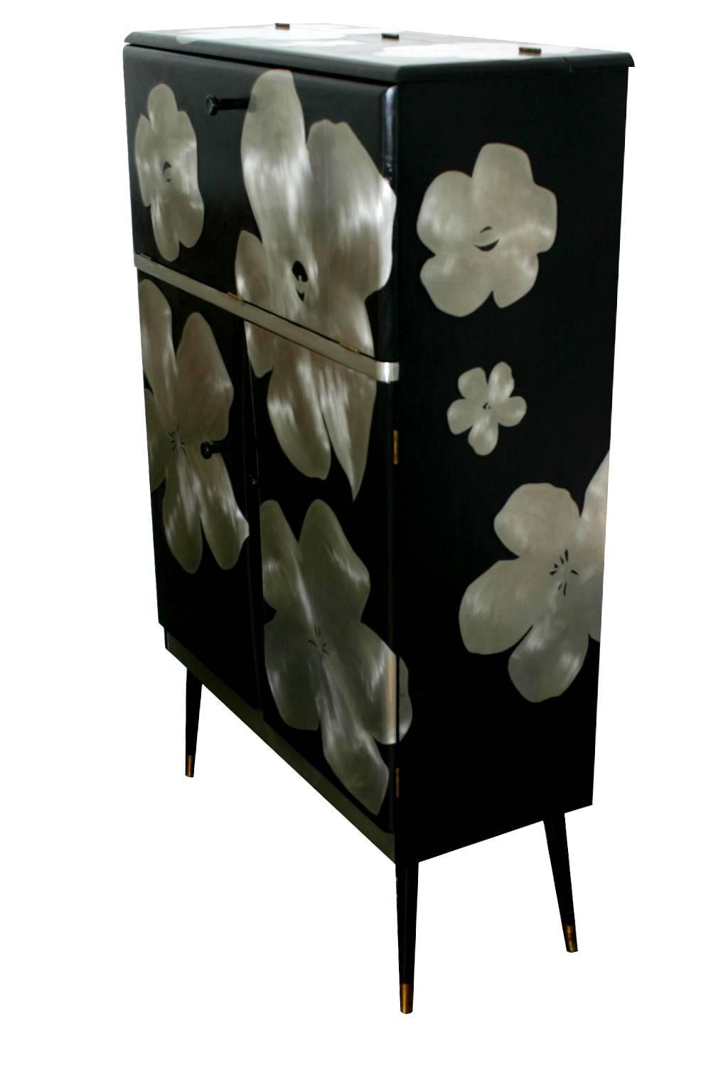 Sheet metal inlaid with gesso on a 20th century cocktail cabinet, with light. All Kate's pieces are one-offs so there will be slight variations with this cabinet although pieces can be sourced to meet individual requirements.