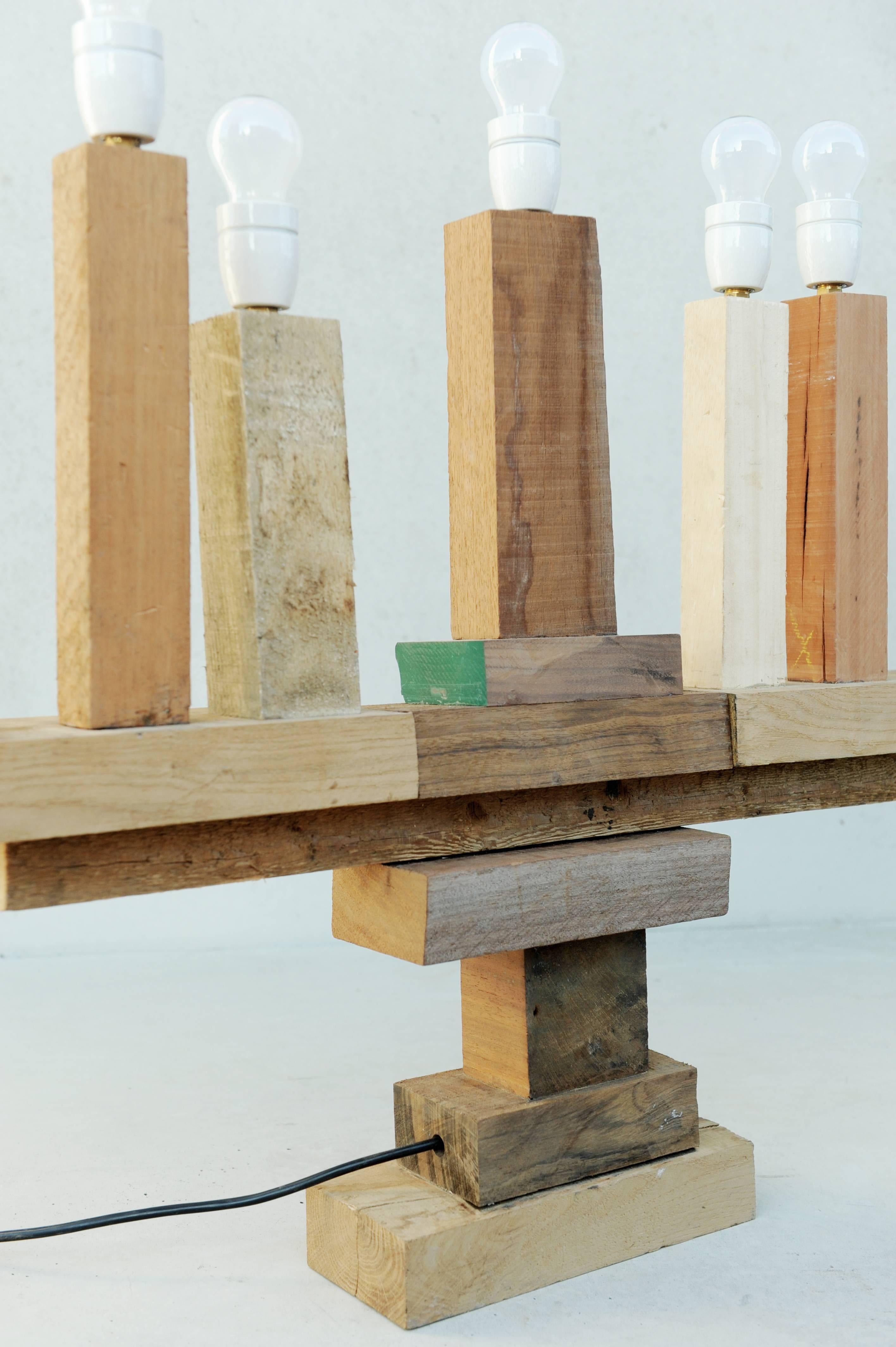 Created from leftover wooden pieces that are to nice to be wasted.
This seven armed handcrafted candelabra, wired from the inside is like a trophy.

       