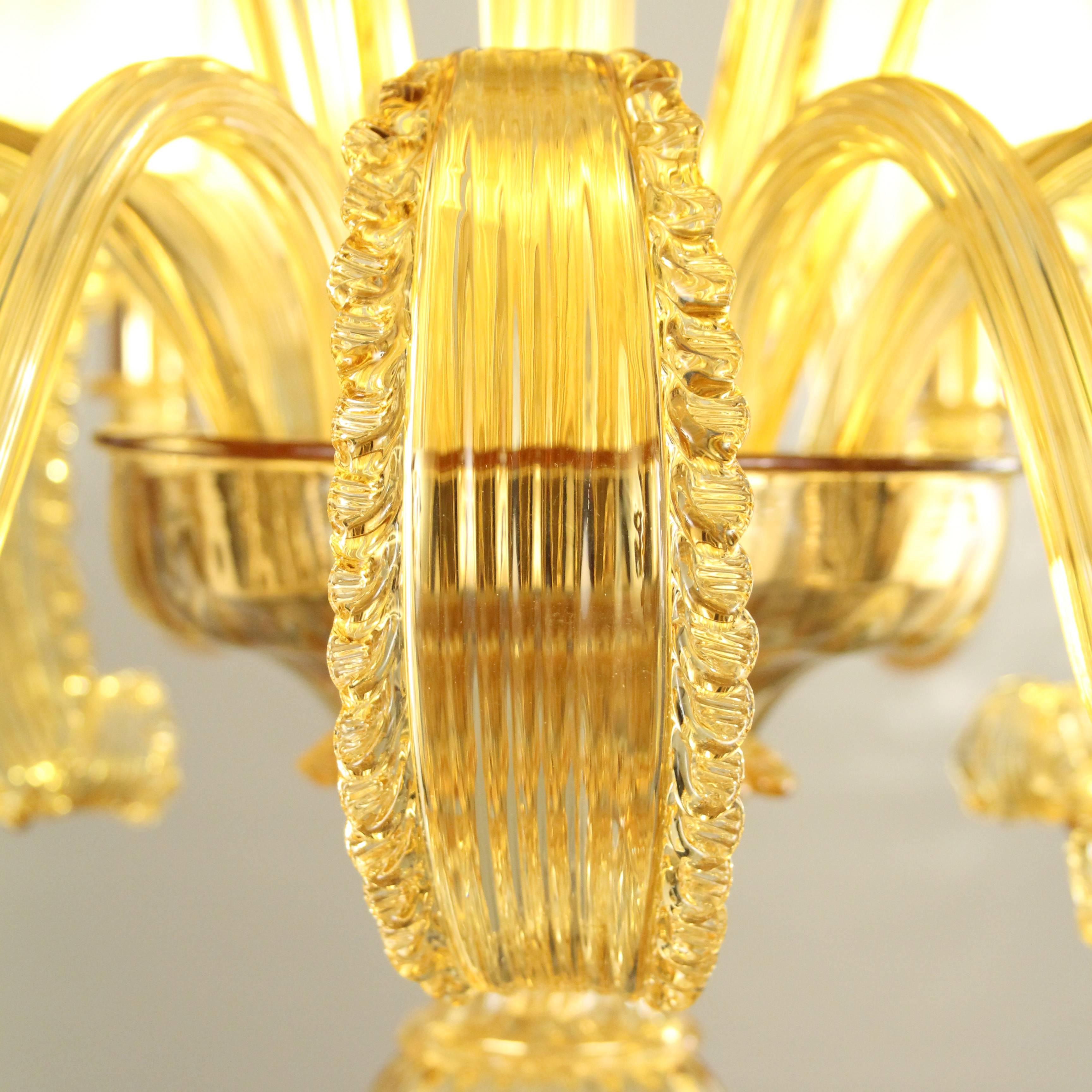 Deco style six-arms Venetian chandelier, handmade with Murano blown glass honey amber color. Golden frame finish.
Organza silk lampshades, handmade in Florence.
Available without lampshades with price reduction.
Spare parts and ceiling canopy and