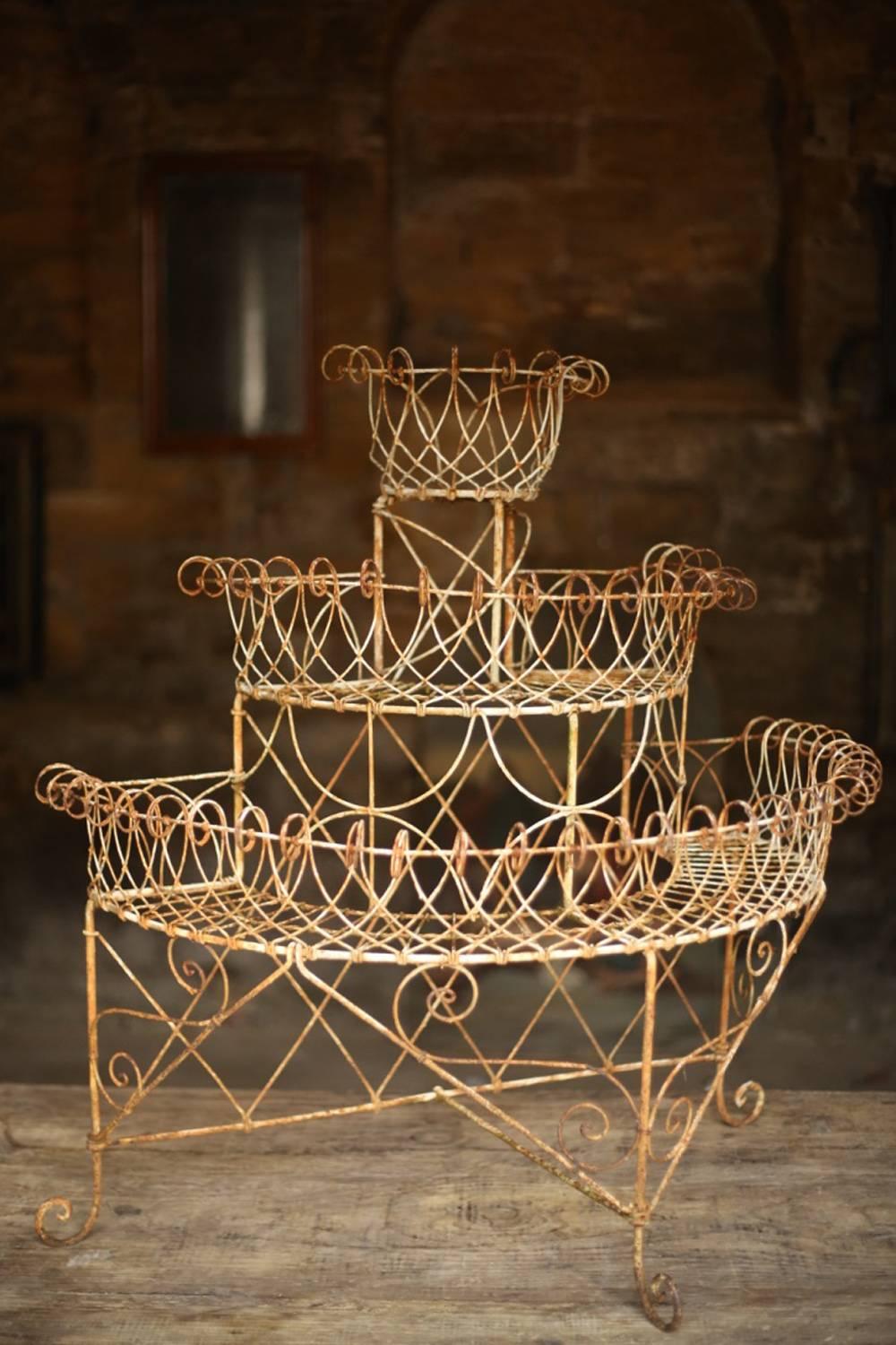 This is an exceptional Regency/early Victorian wirework plant stand. It came from an estate in Scotland with another wirework planter currently for sale. This one is simply superb. It is in untouched condition with no damage or faults and is very
