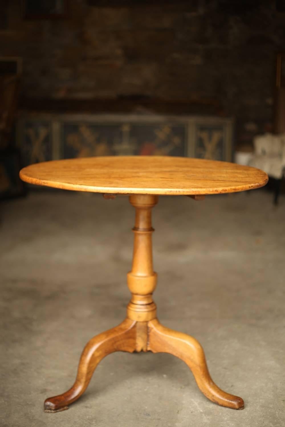 This is a very smart late 18th century burr elm tilt top table. It is the most amazing color with fabulous patina and superb grain. The quality is very high with no serious damage just light wear. There is a piece of board tacked in to the side of
