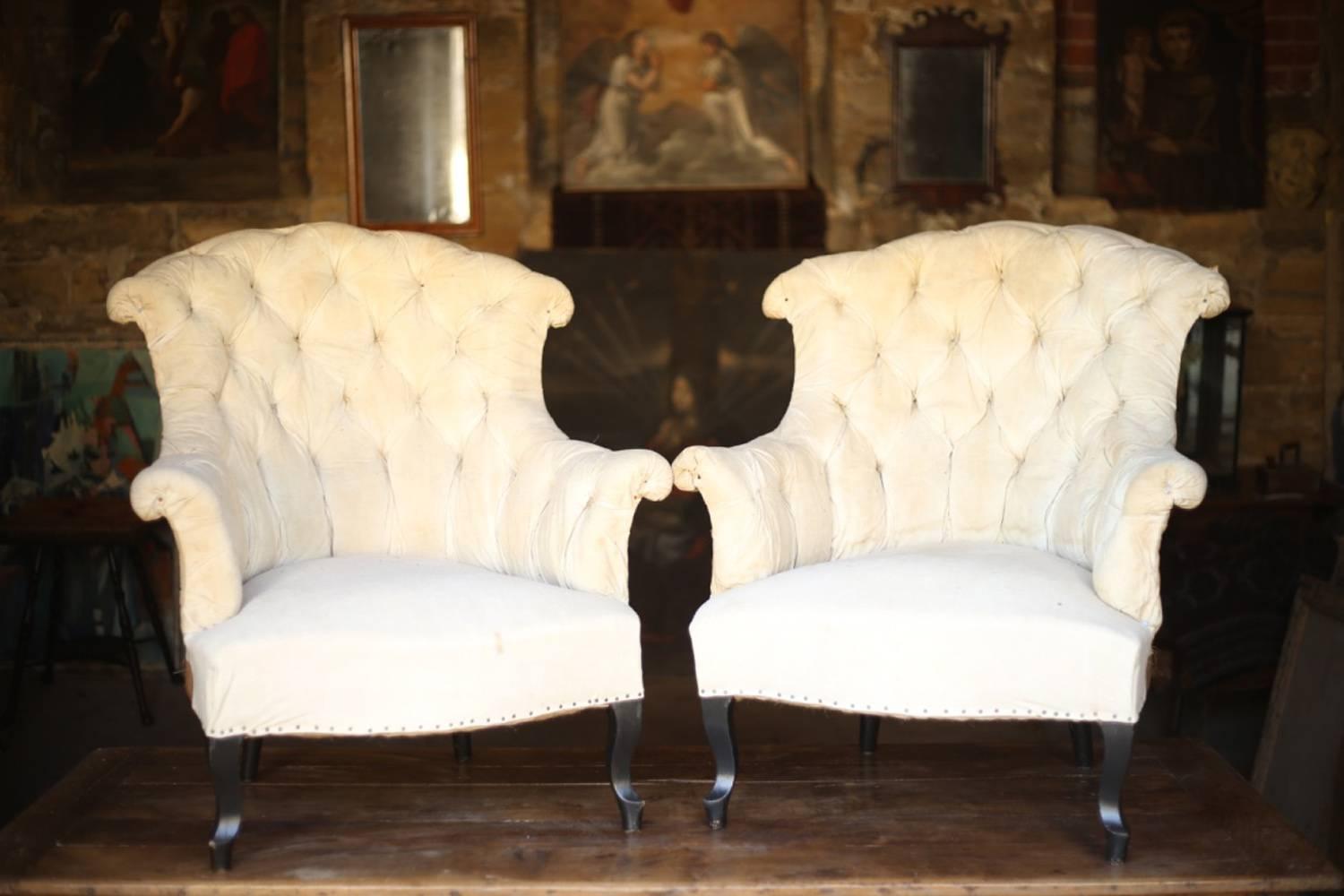 These are a very elegant pair Napoleon III armchair with buttoned back. They are in fully restored condition and is now ready for reupholstery. They retain their original calico and horse hair stuffing. The shape of these chairs is very stylish,