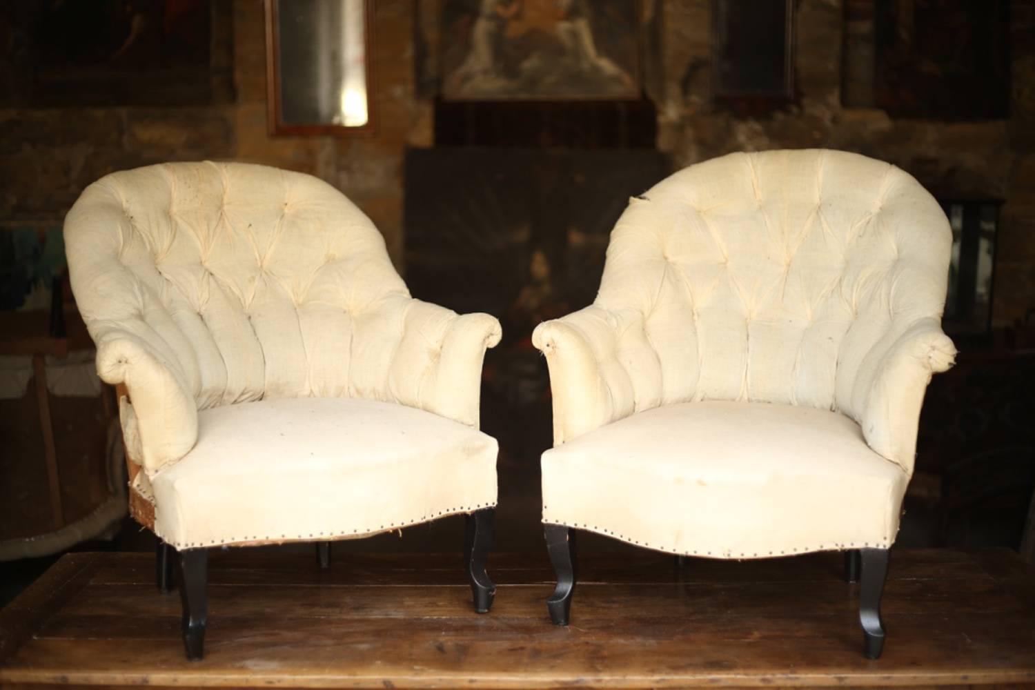 These are a gorgeous pair Napoleon III armchairs with buttoned back. They are in fully restored condition and are now ready for reupholstery. They retain their original calico and horse hair stuffing. The shape of these chairs is very stylish,