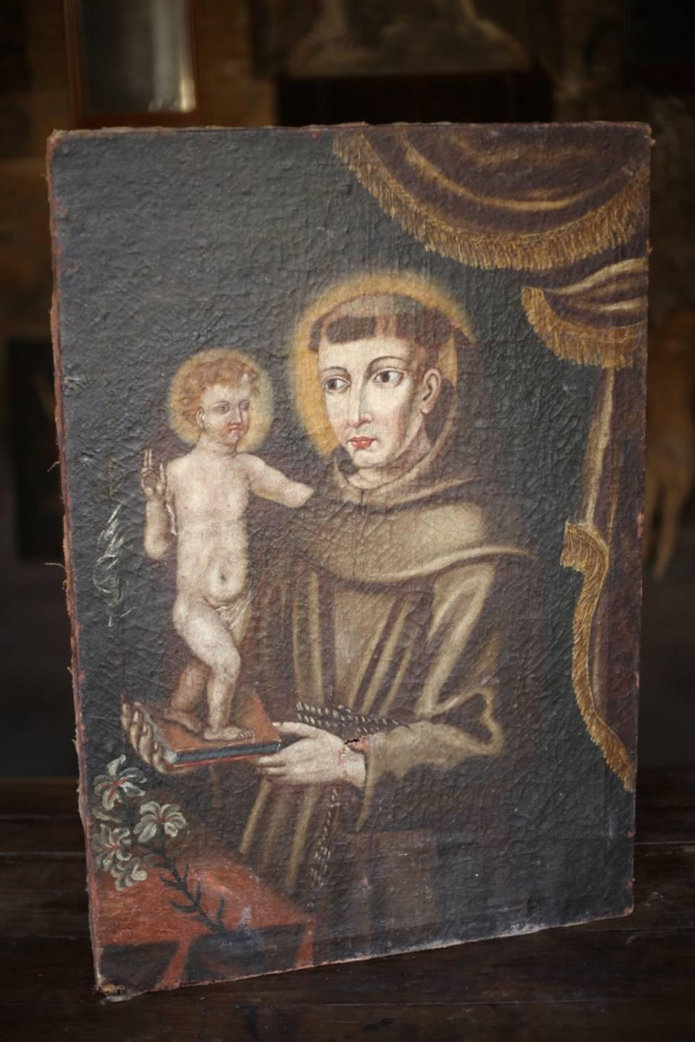 This is a extremely nice 18th century oil on canvas painting of St Dominic holding the bible with a icon figure standing on top of it. I believe the icon figure is that of a baby Jesus. St Dominic who's followers are known as the Dominicans was