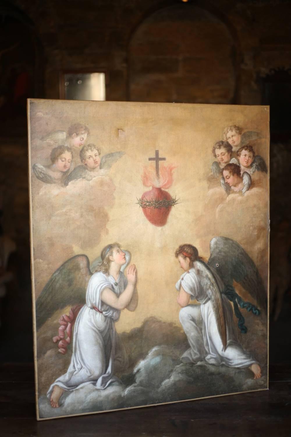 This is an exceptional late 18th early 19th century oil on canvas painting of Angels surrounding the sacred heart. The details and the quality of the work is fantastic there are no blemish's or faults it is just clean and highly detailed. The pale