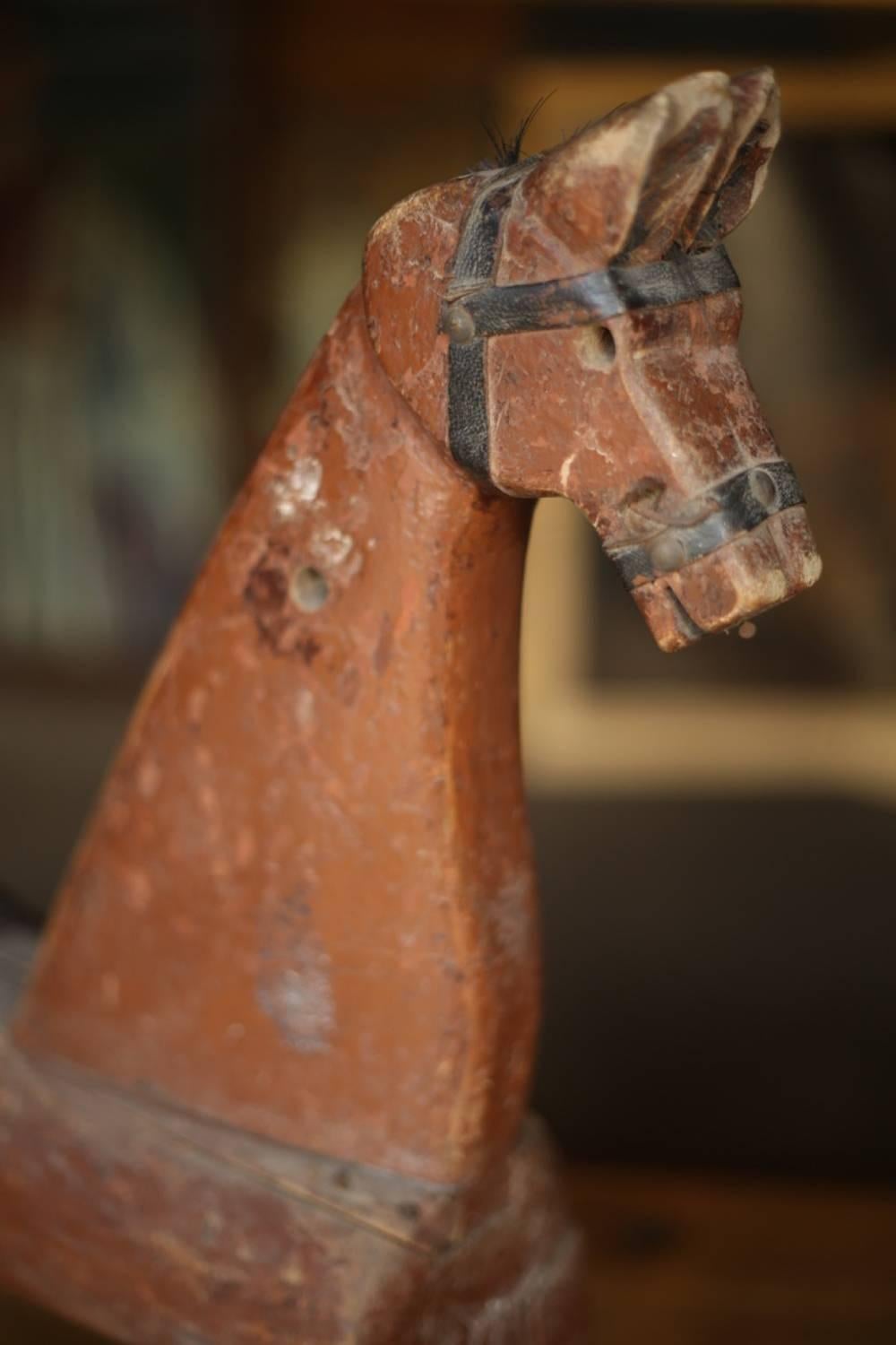 This is a beautiful and rare 19th century carved wooden model of a horse from Sweden. The majority of the original paint is still in place. The naivety of the carving and the simplicity of the construction is what makes this item so attractive. It