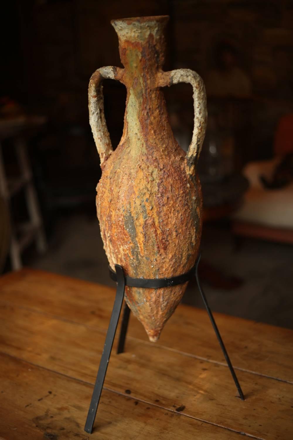 This is an absolutely fantastic large ancient Greek wine amphora. It was found on the sea bed hundreds of years after the ship it was on sunk. Originally it would have been used to carry wine. After the ship sank the piece was in the sea for years