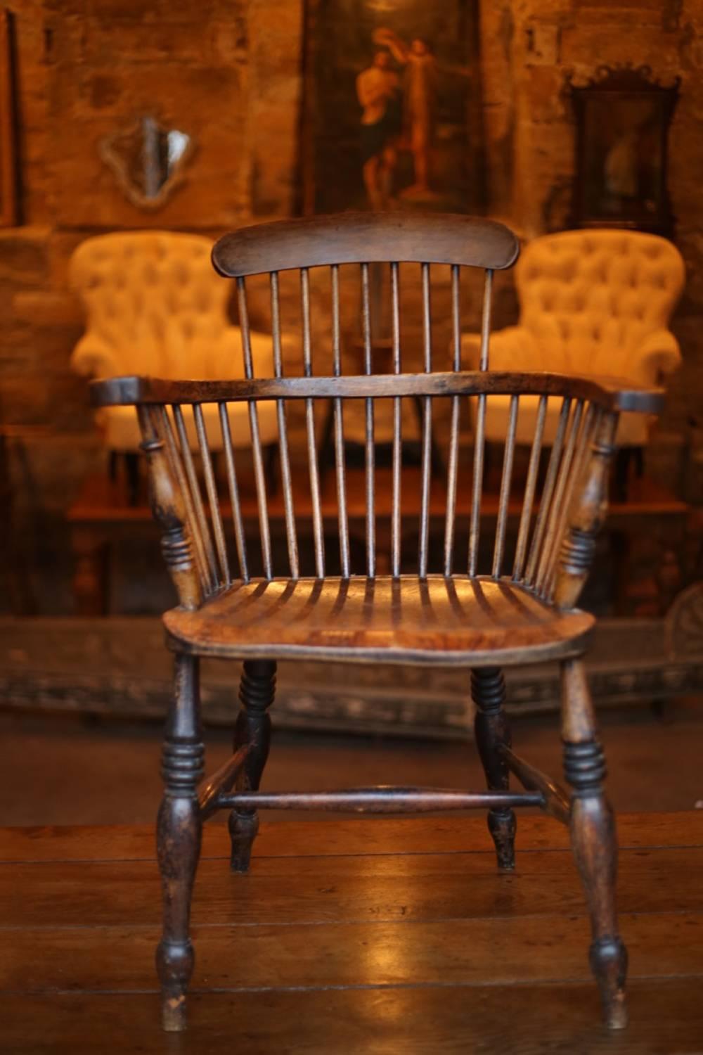 This is a gorgeous and rare designed late 18th-early 19th century Windsor armchair. I have not seen many with this stylish design before and this is by far the best condition one. There is no weakness or movement and it retains a lot of the original