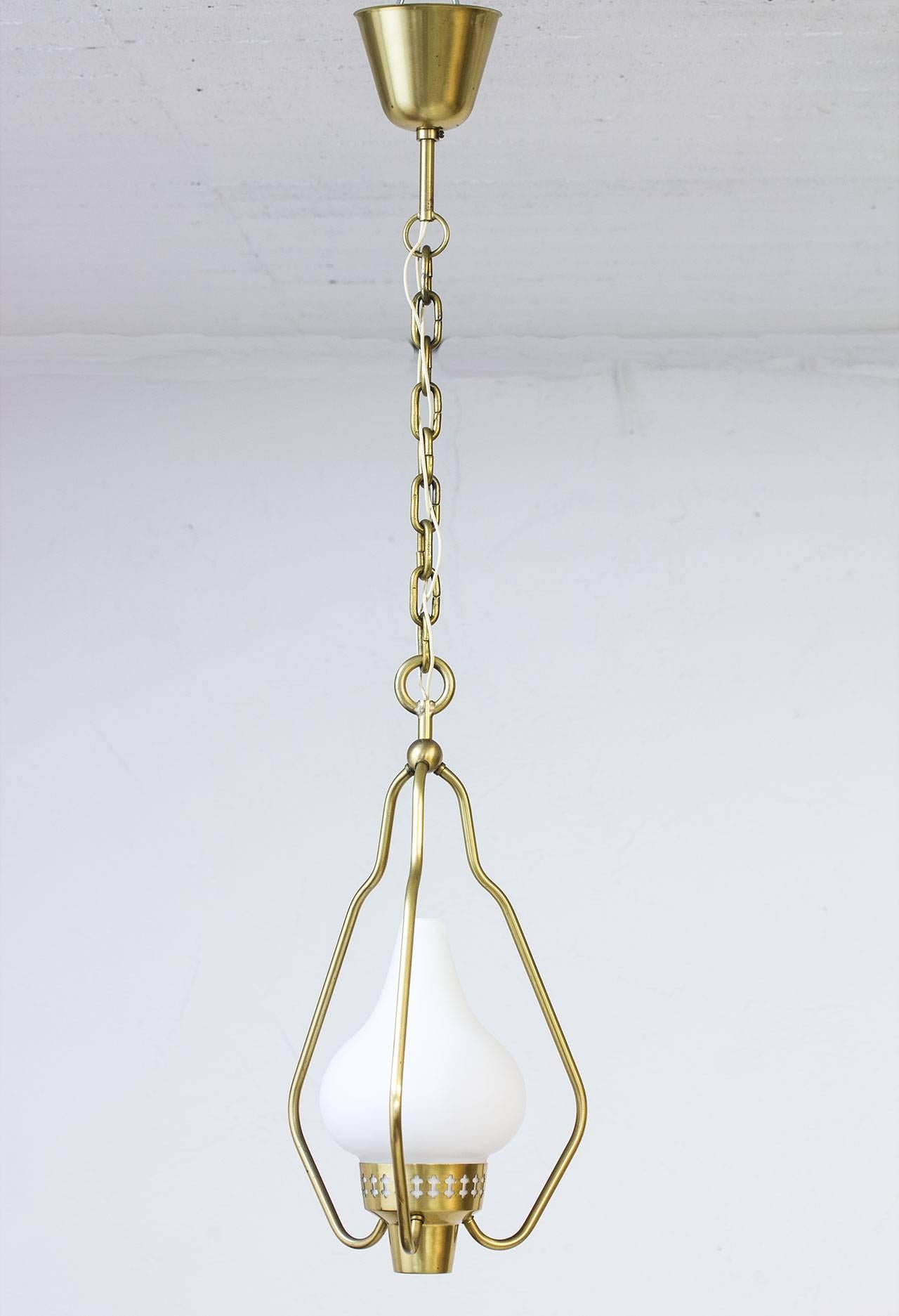 1950s pendant lamp designed by Hans Bergström, produced by ASEA in Sweden. Brass chain or frame and opaline glass shade.