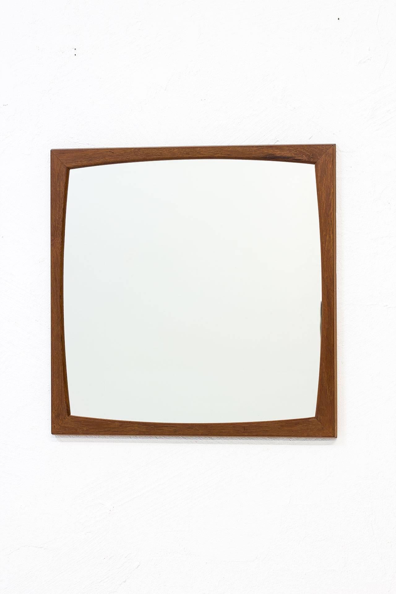 Square solid teak mirror N° 102
designed by Kai Kristiansen.
Produced in Denmark by Aksel
Kjaersgaard during the 1950s.
Signed on the back.