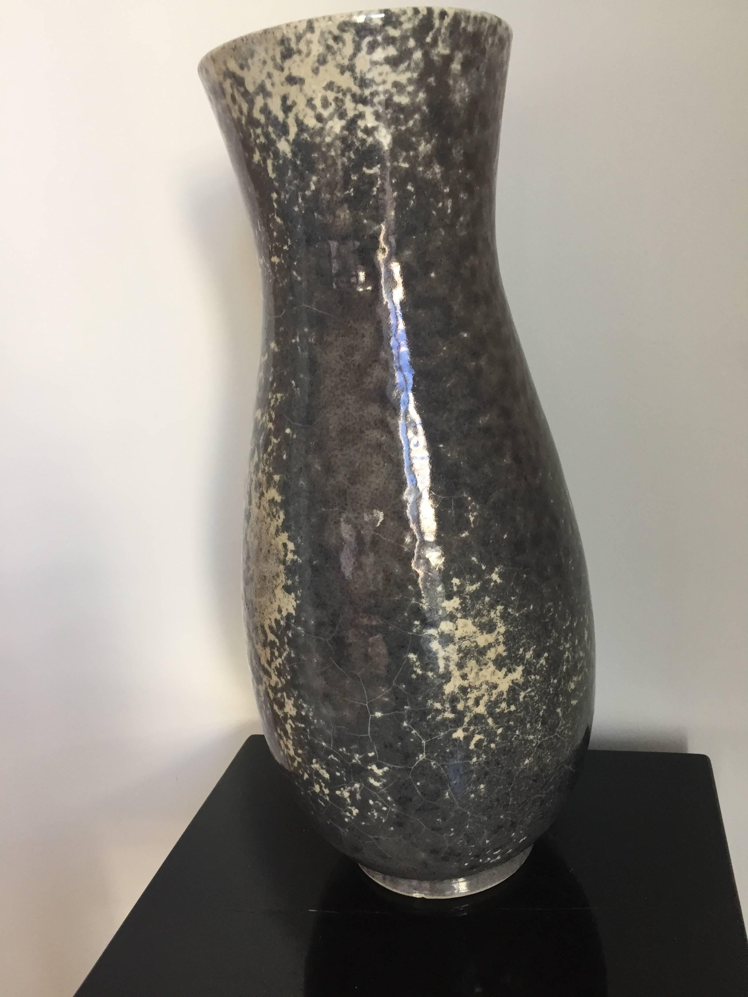 Rare ceramic vase by Richard Uhlemeyer, German Ceramist,

Large floor vase, beautiful glaze in grey and off-white shades

Germany, 1940s, stamped at the bottom edge, minor damage at the 
Bottom edge, size 52cm high x 34cm diameter.
  
