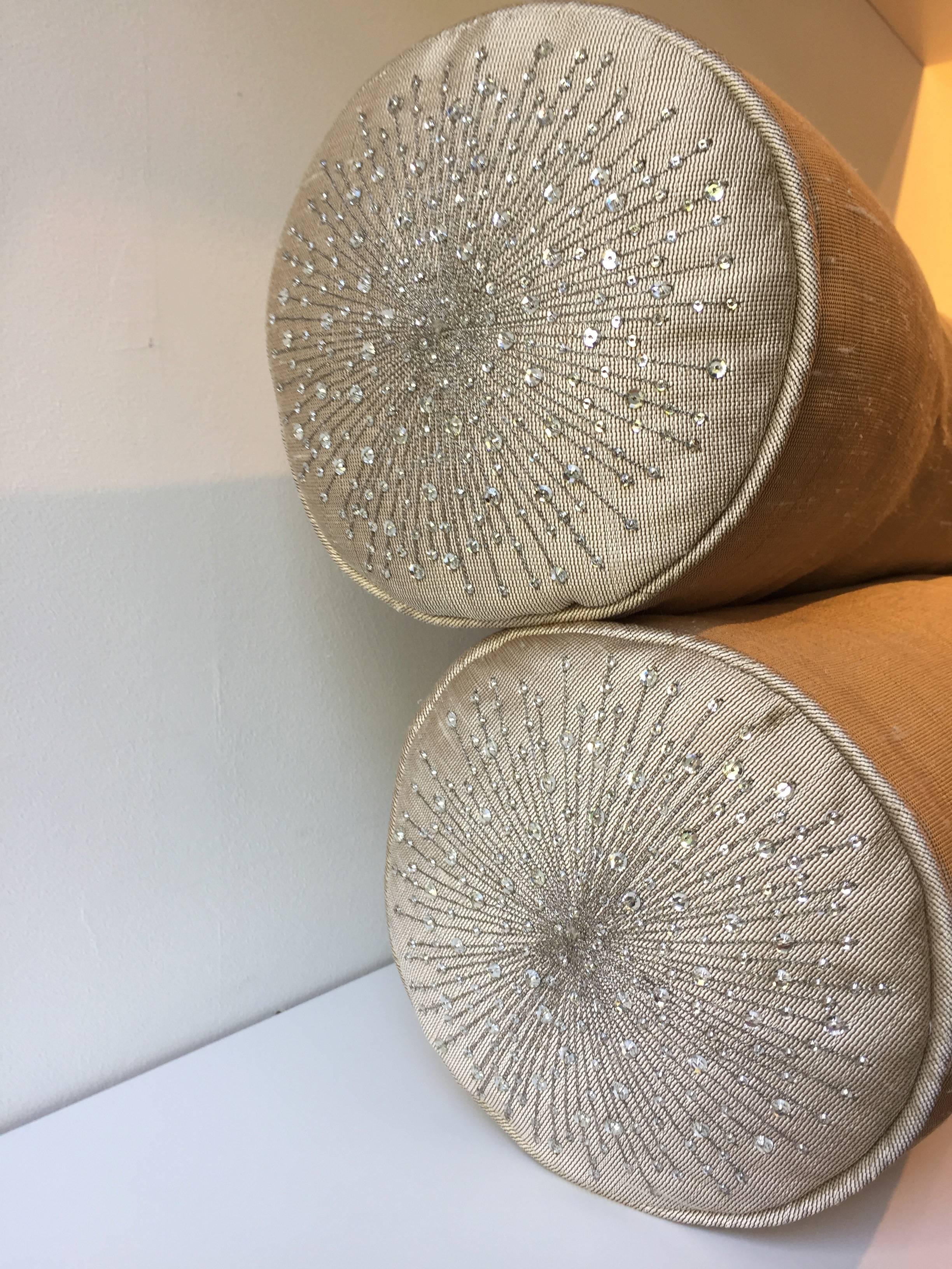 One pair of bolster cushions, each bolster has two no hand embroidered side pads with silver thread and Swarovski crystals color crystal, self piped, handwoven silk Bruno triplet color bamboo, size 19cm diameter x 60cm length, bolster covers with